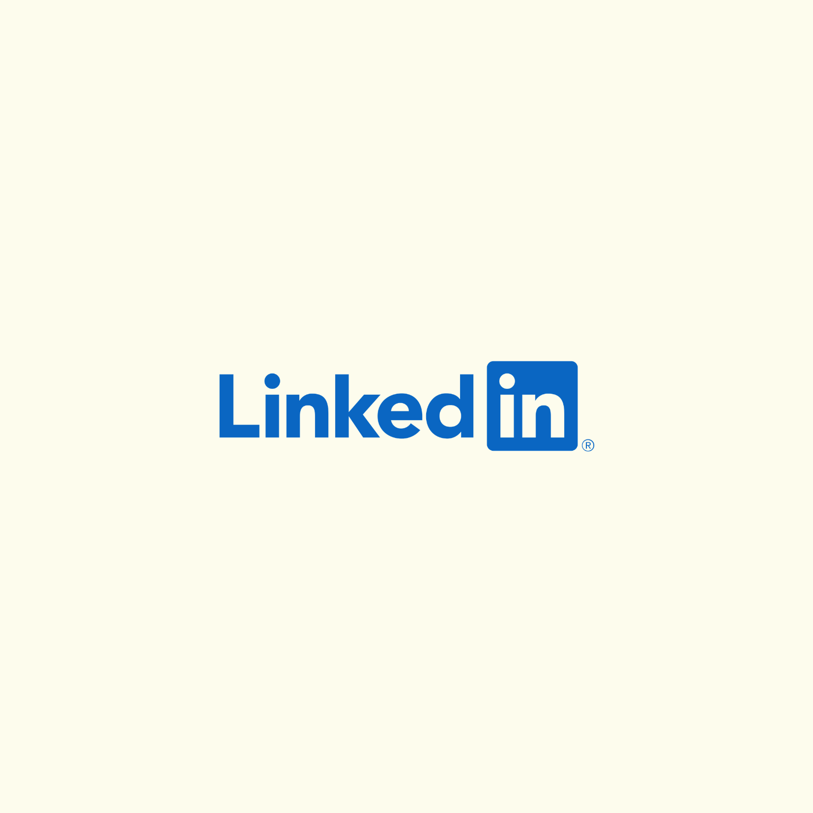 LinkedIn logo with blue text and icon on a beige background.
