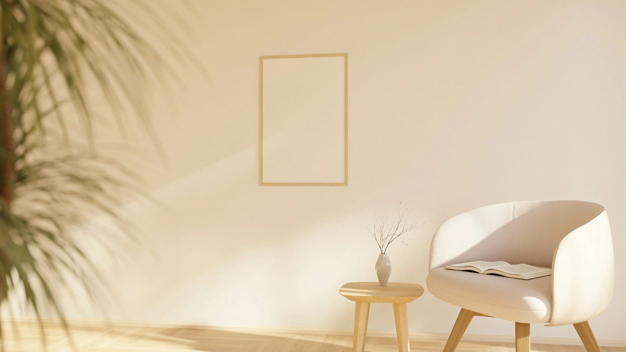 Minimalist living room with a white curved armchair, a small round wooden side table with a white vase and dried branches, a framed empty white wall, and a soft beige wall with a ceiling light.