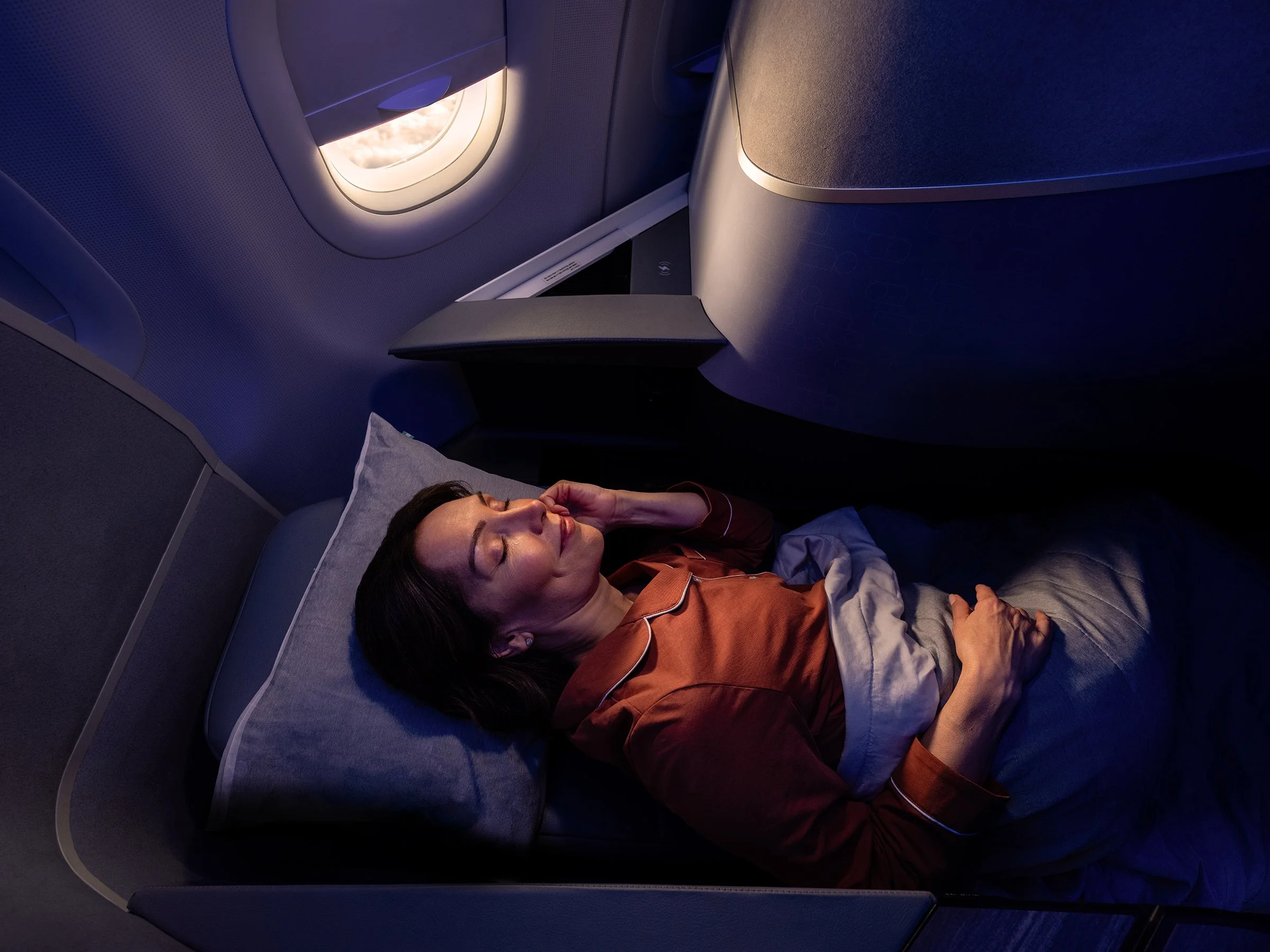 JetBlue Mint Day to Night Bed  Woman sleeping.jpg