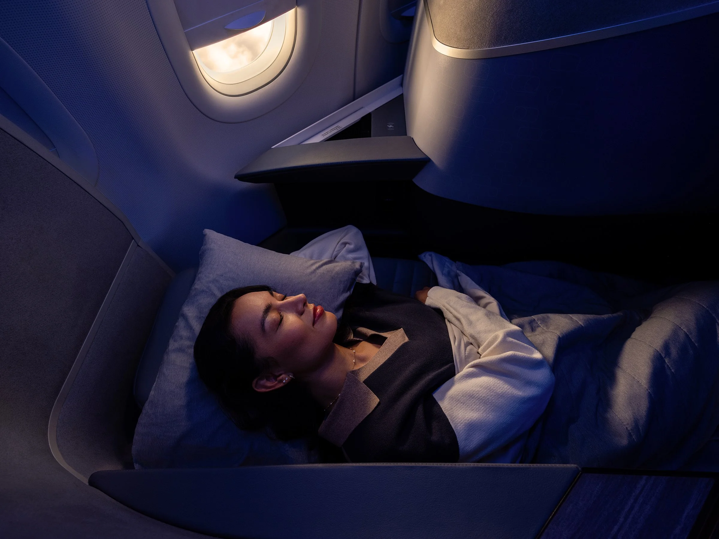 JetBlue Mint Day to Night woman sleeping 2.jpg