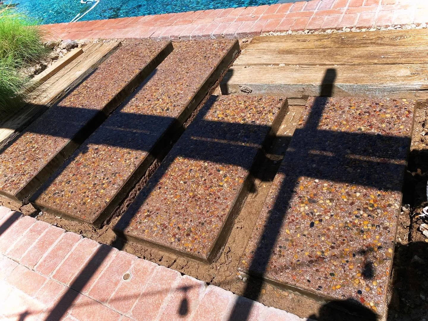 This client had a vision, and we took it from the abstract to the concrete. This batch had to be hand-mixed to achieve the right color, and specialty aggregate had to be sourced and added at just the right time for this one-of-a-kind exposed finish.
