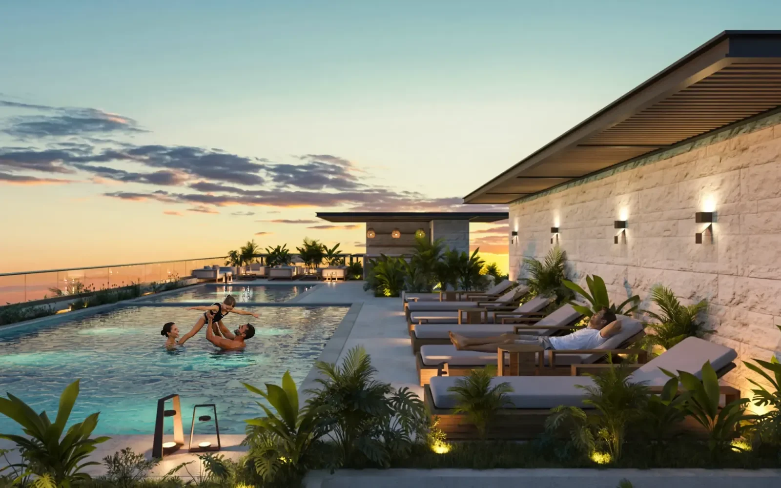 Alberca rooftop en Artemisa Cancún con camastros y área lounge, personas disfrutando al atardecer con vista panorámica