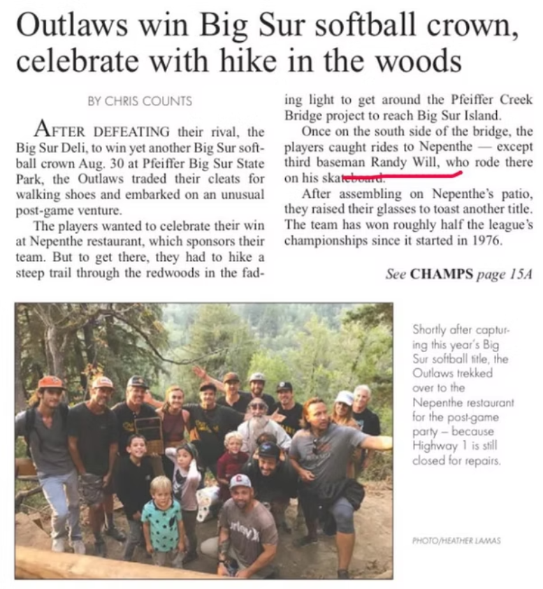 A group photo of people, including children, posing outdoors in a wooded area, celebrating at a Big Sur softball event.