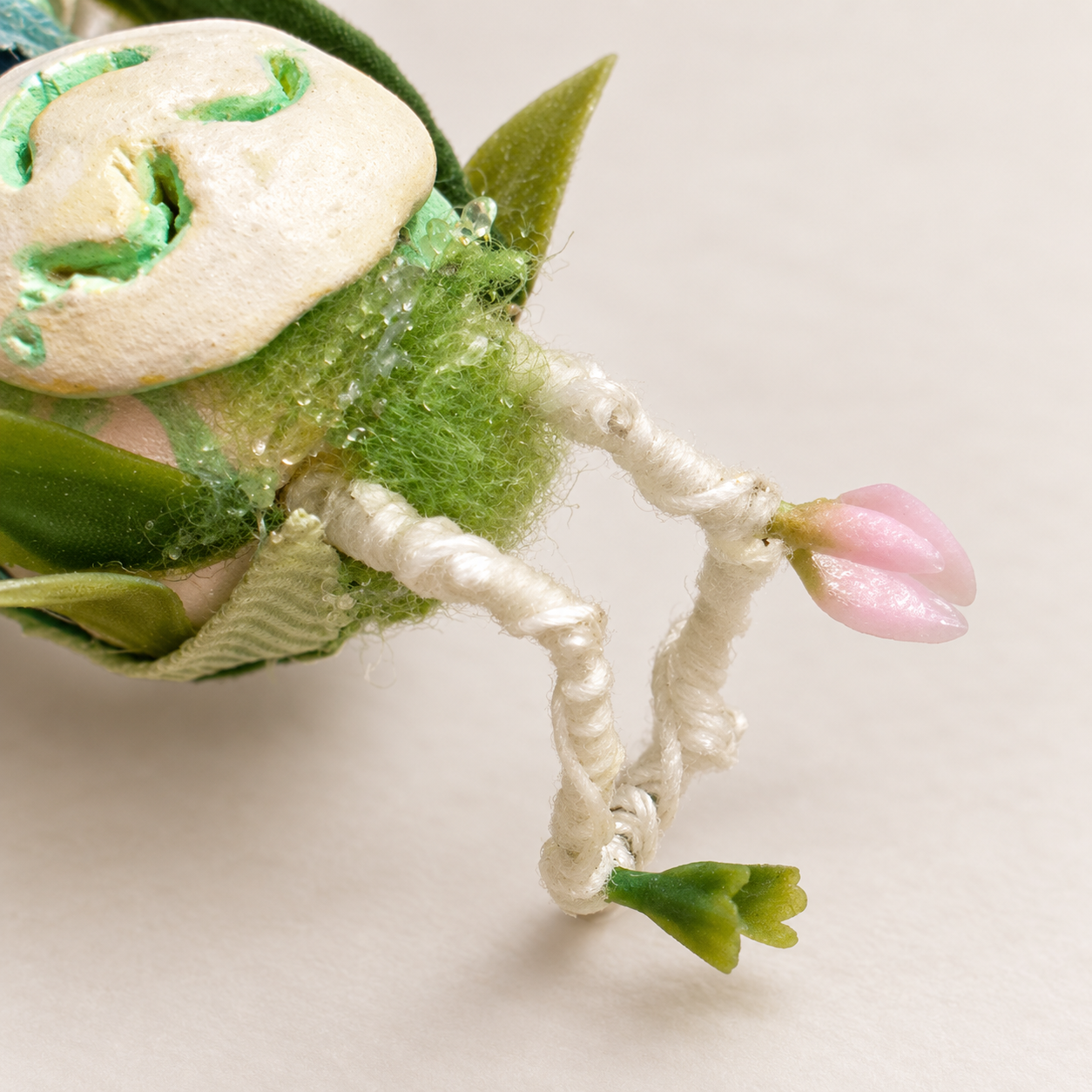 Flora, Bingo’s handmade clay character, shown from the front in a black jeweled outfit.
