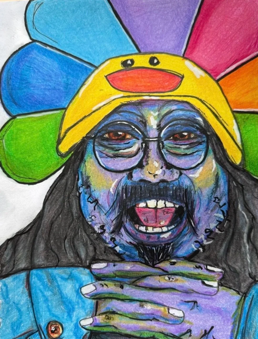 Colorful drawing of a man with long hair, beard, and glasses, wearing a yellow hat with a cartoon face, surrounded by rainbow-colored petals.