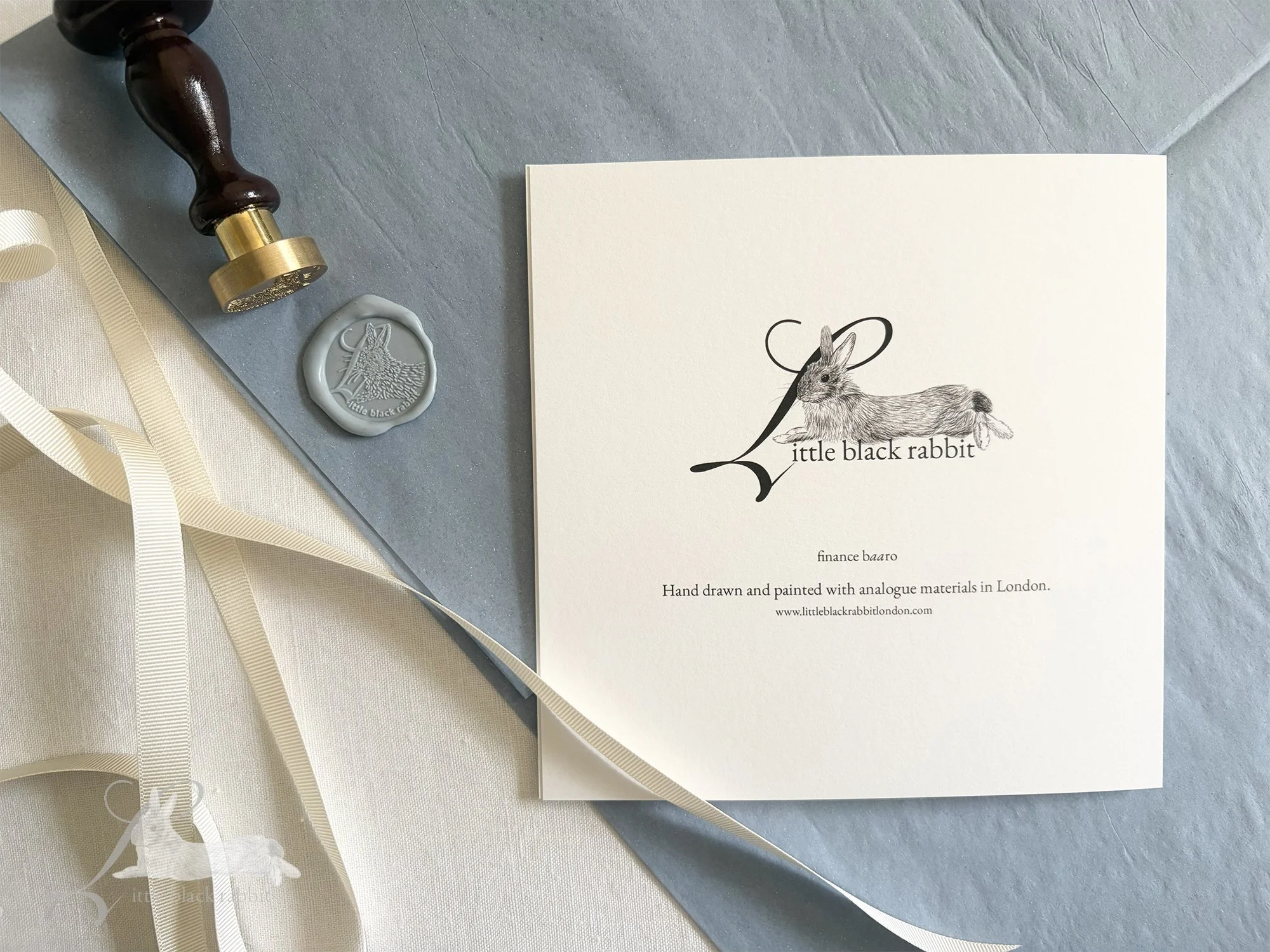 Greetings card reverse side showing the Little Black Rabbit logo and the design title 'Finance Baaro'.