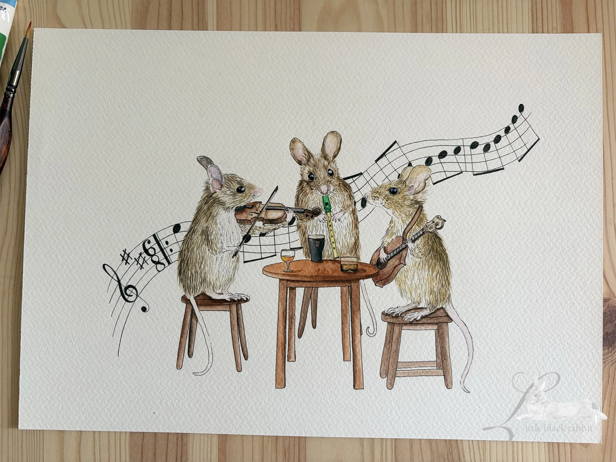 Original watercolour painting of three mice at a trad session in a pub, with a tiny violin, mandolin and tin whistle, and a guinness, whiskey and sherry.