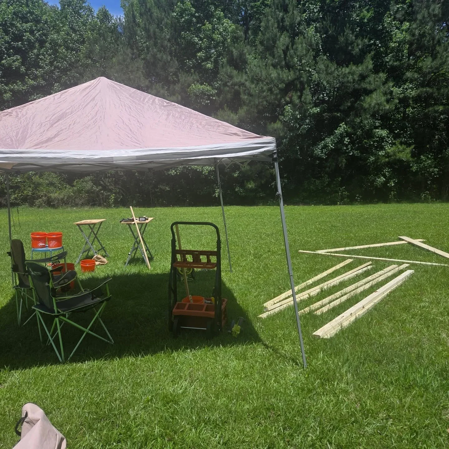 A Gem cleaning set up to wash our haul from @bigfoot_gem_mine and building the first 'House' of Blossom and Bone. #festivalseason #encampmentincoming #houseofblossomandbone #build your community #boardbyboard faeblessed