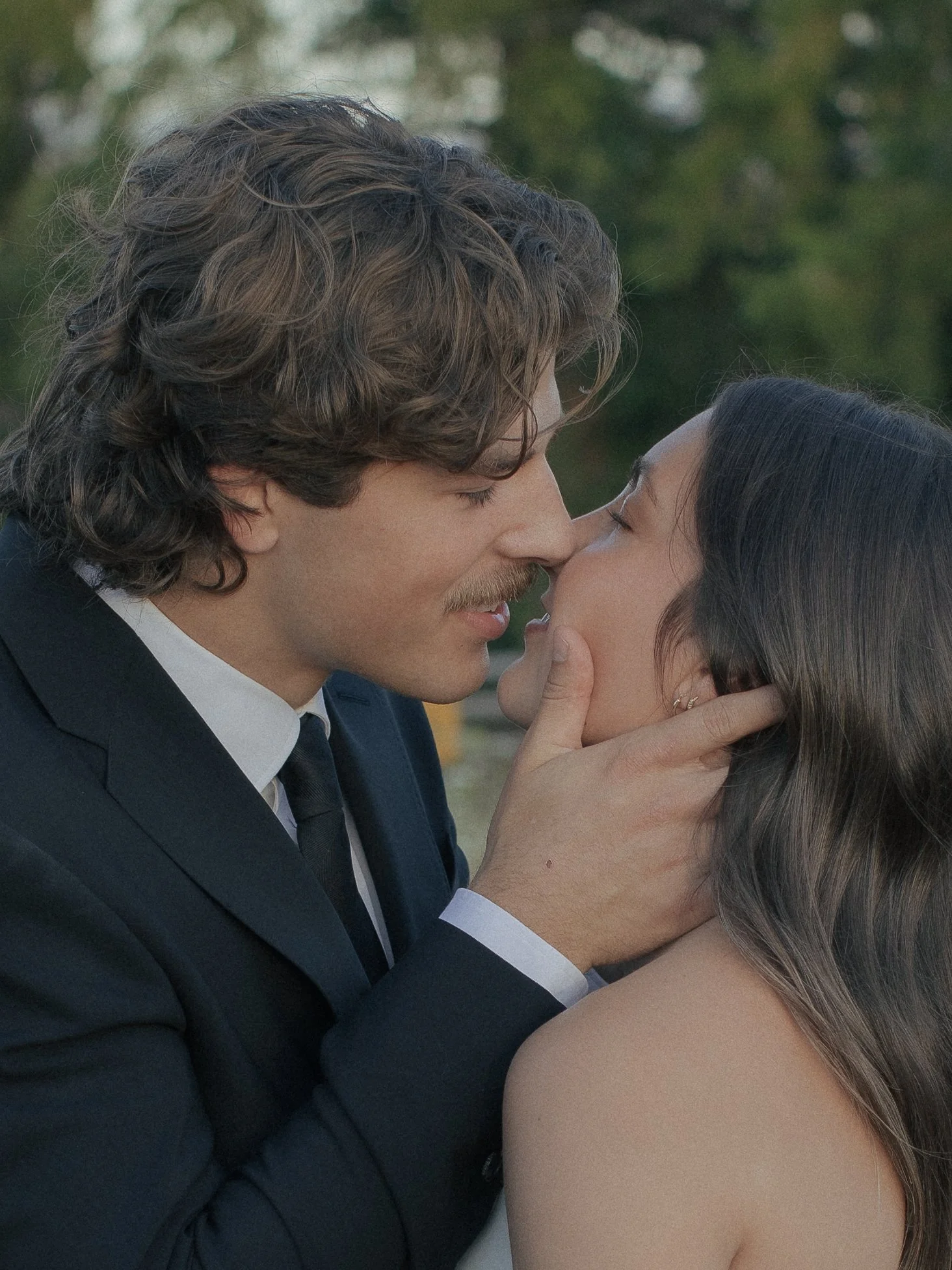 Man and woman in an embrace about to kiss