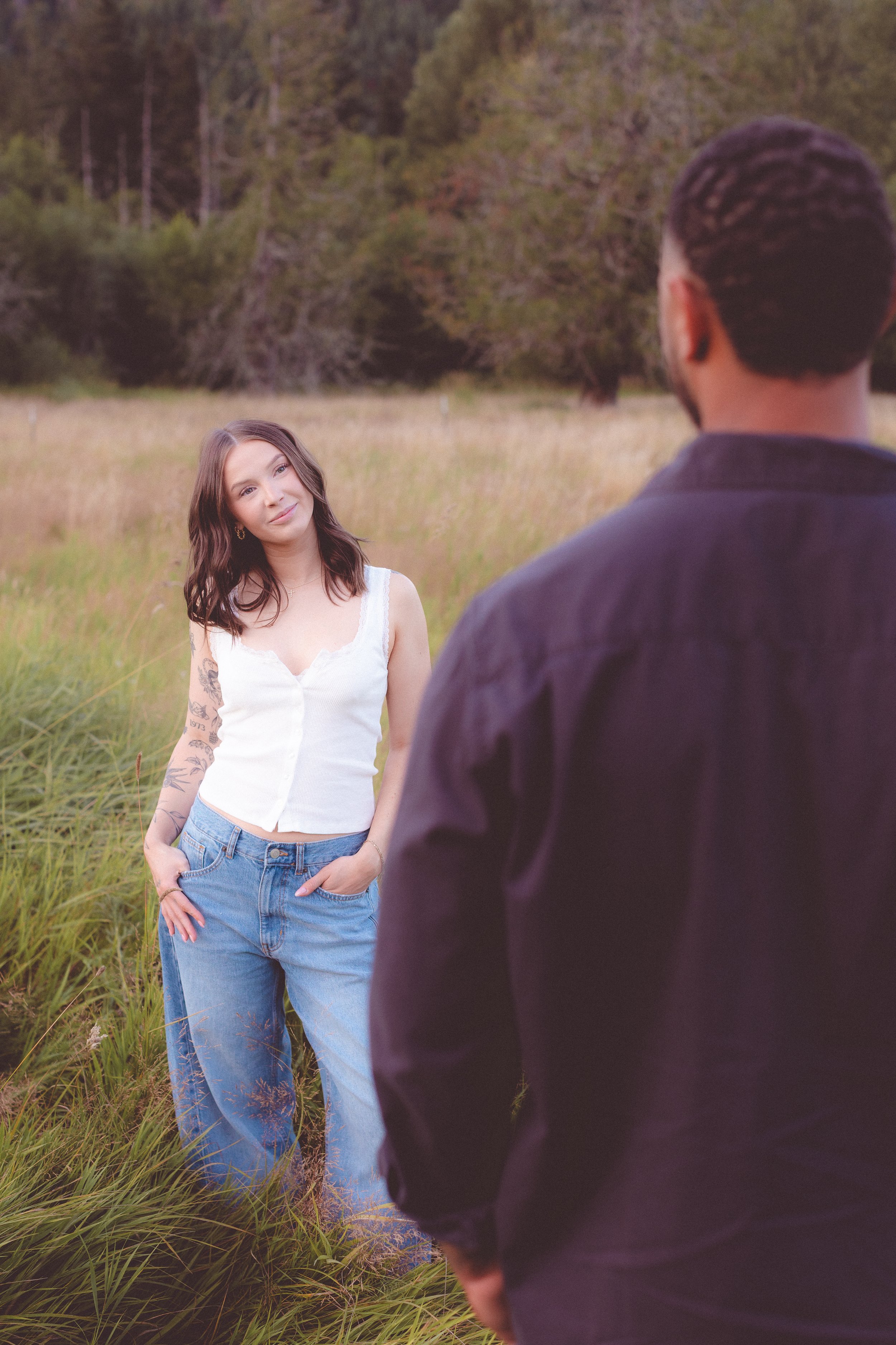 Woman looking at man with his back to the camera. 