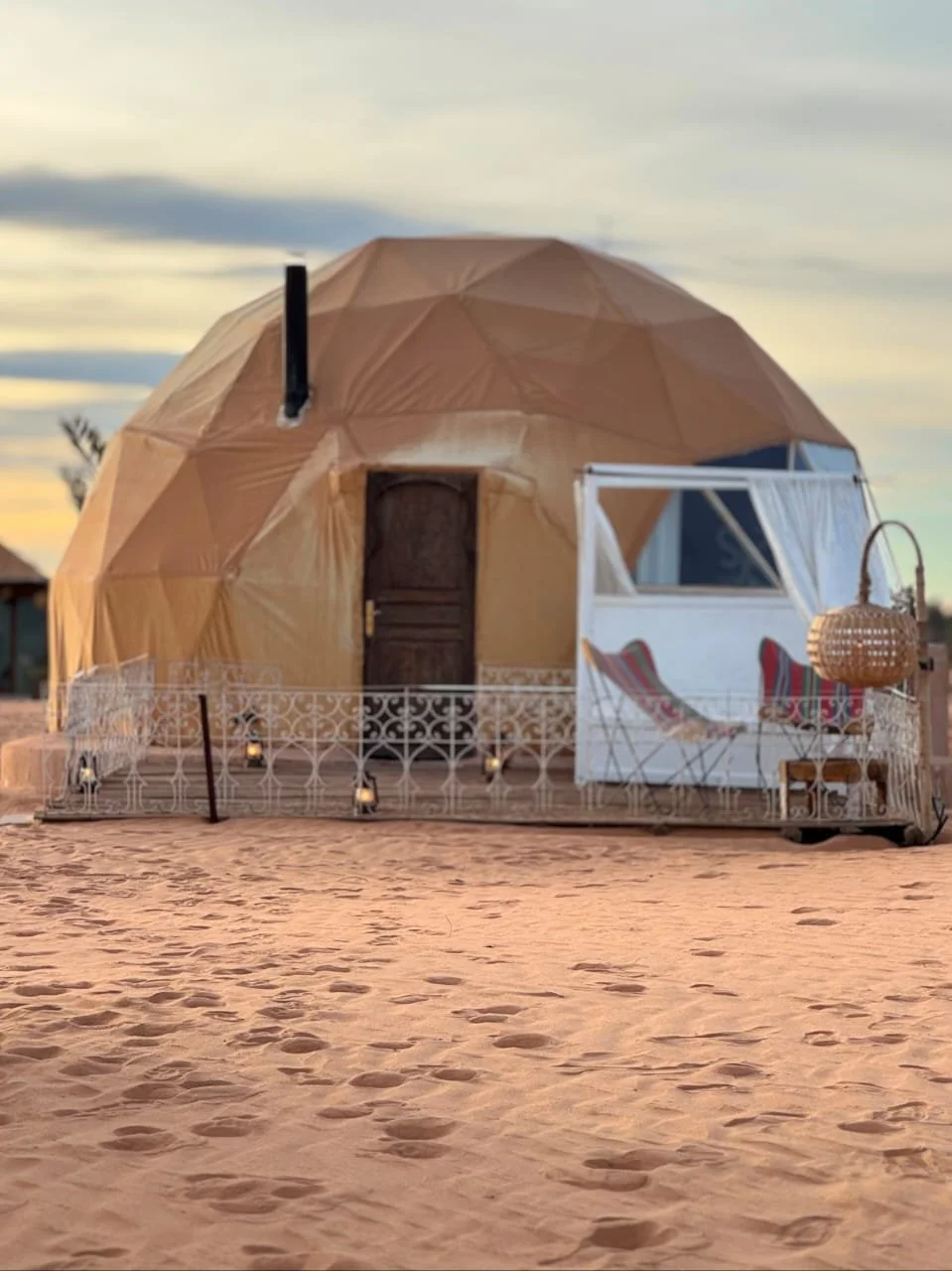 Luxury geodesic dome tent at a desert glamping camp in the Sahara
