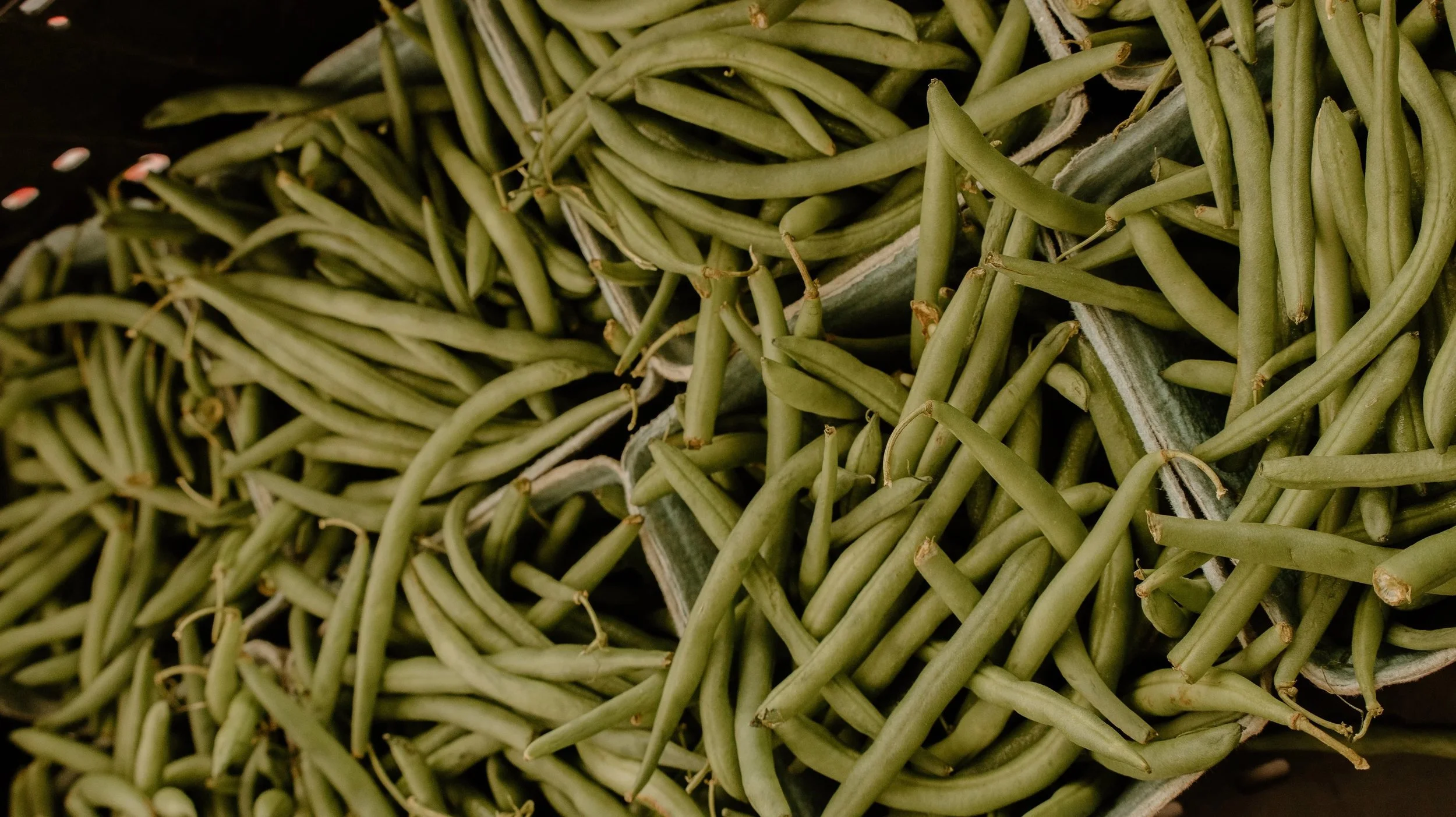Close-up of green beans in a basket.