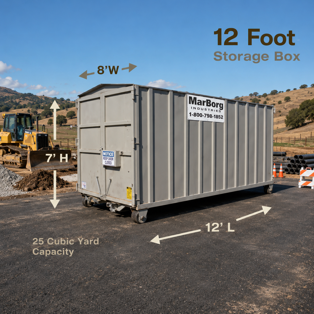 A 12' storage container sitting on asphalt near a construction site with rolling hills in the background and a blue sky overhead.