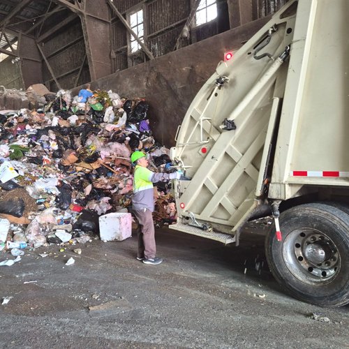 Truck dumping a load on the tipping floor