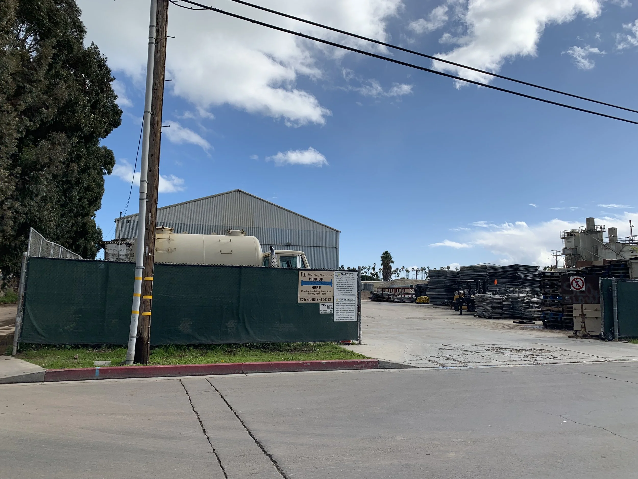 An industrial yard that stores fencingmulch, and other types of rubble