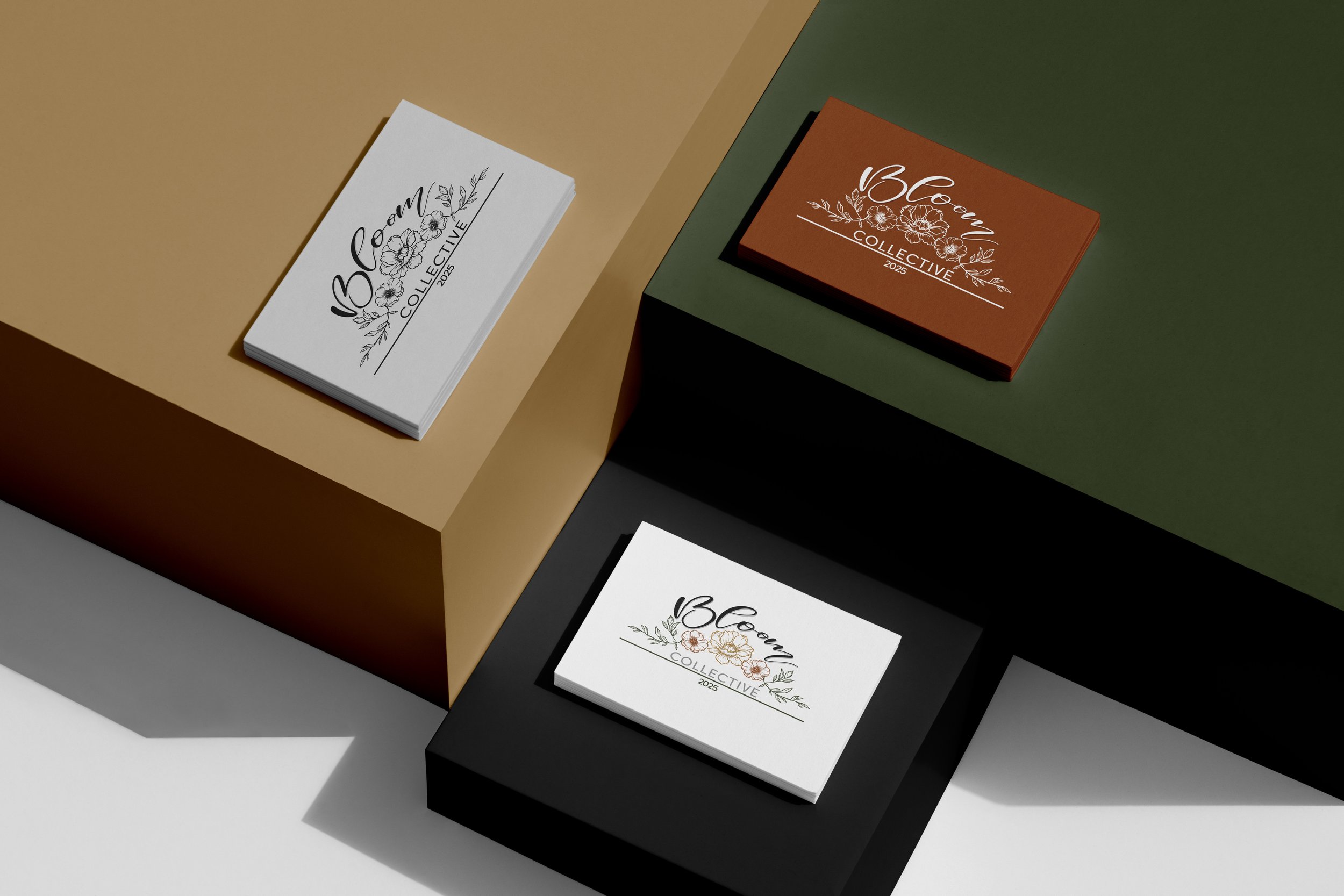Close-up of promotional cards for Bloem Collective 2025, featuring floral designs and modern fonts, placed on colorful geometric backgrounds.