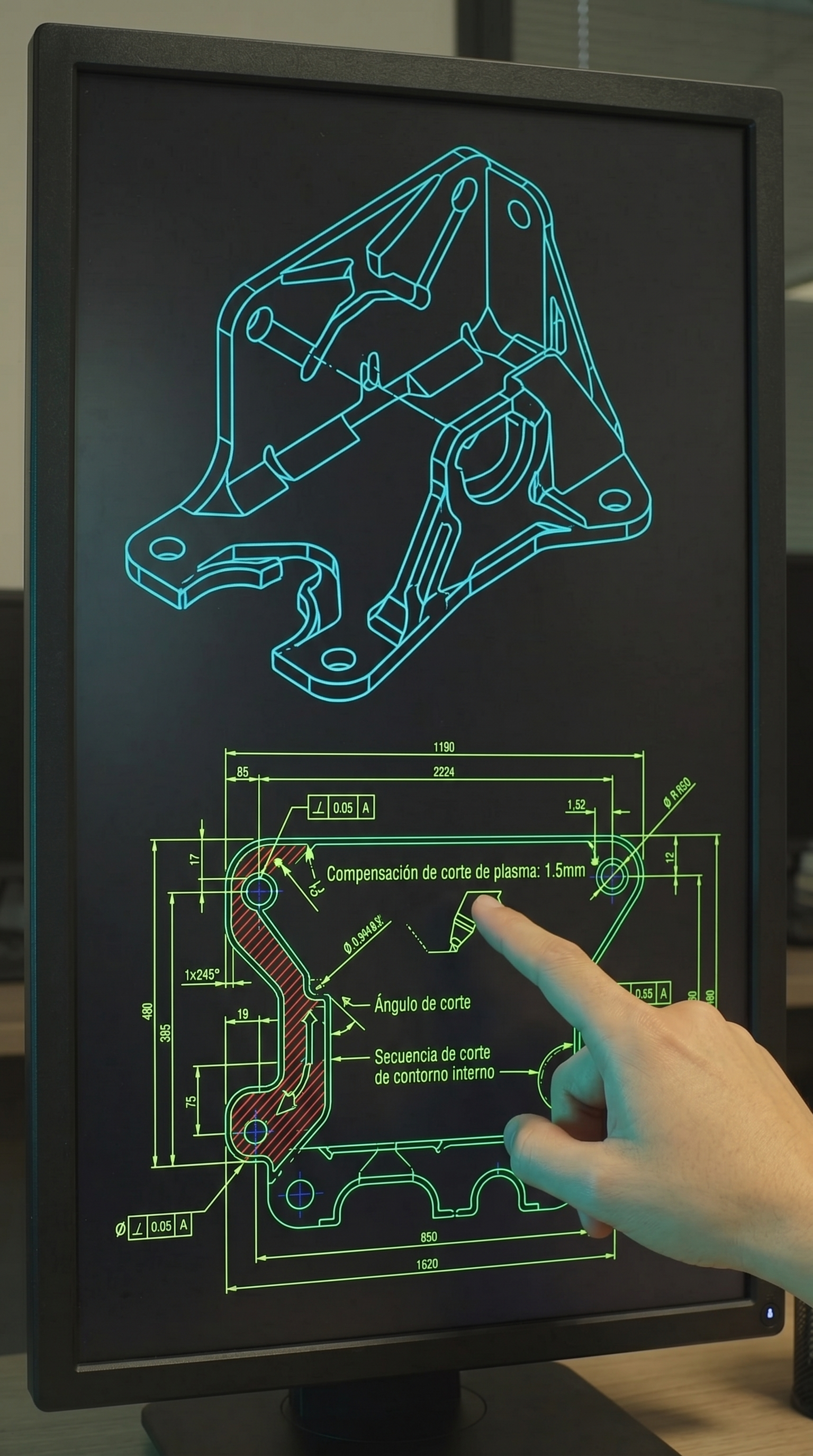 Pantalla de computadora con un diseño técnico y plano en color neón verde y azul que muestra un componente mecánico, con una mano señalando una parte específica del diagrama.