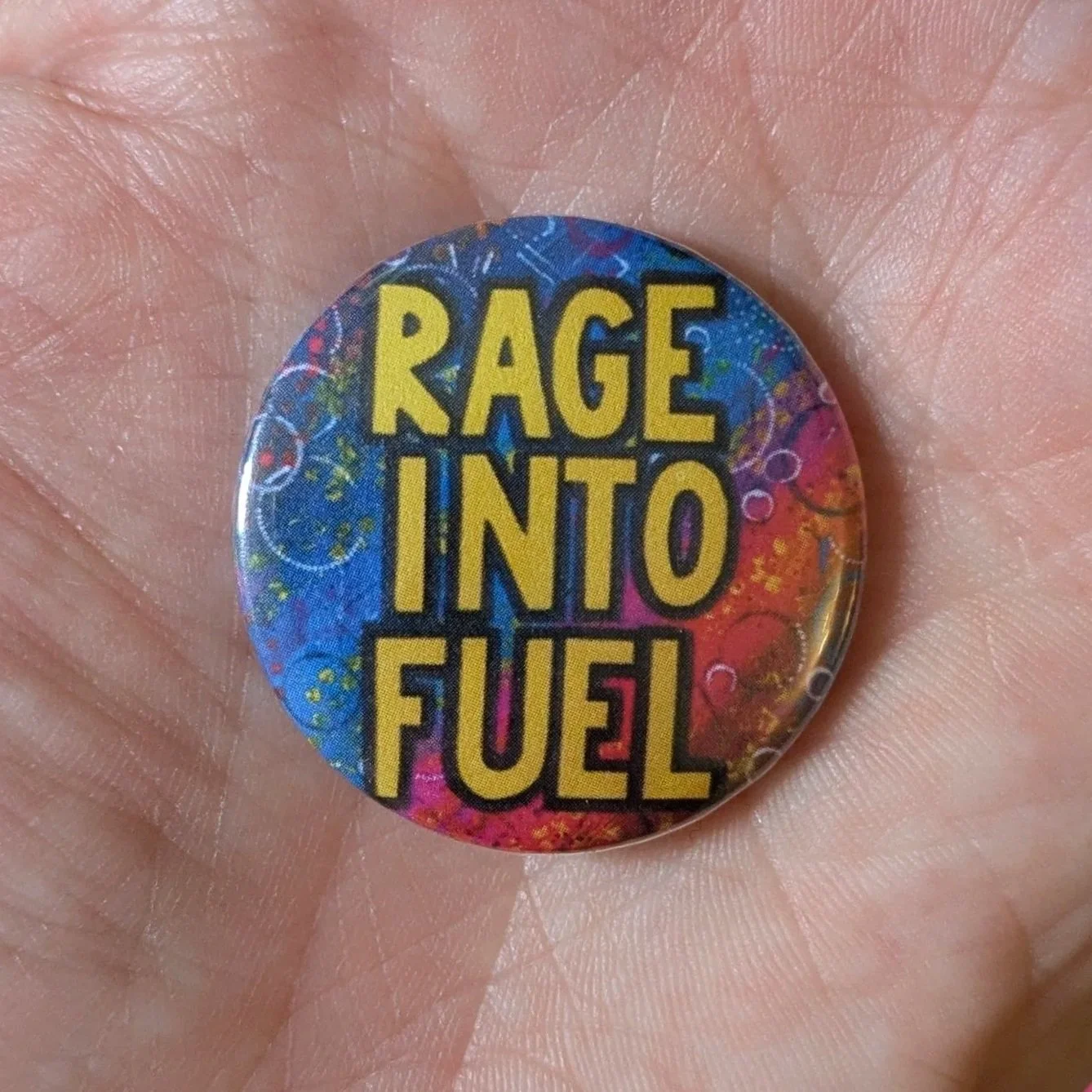 Rage Into Fuel Pin Badge