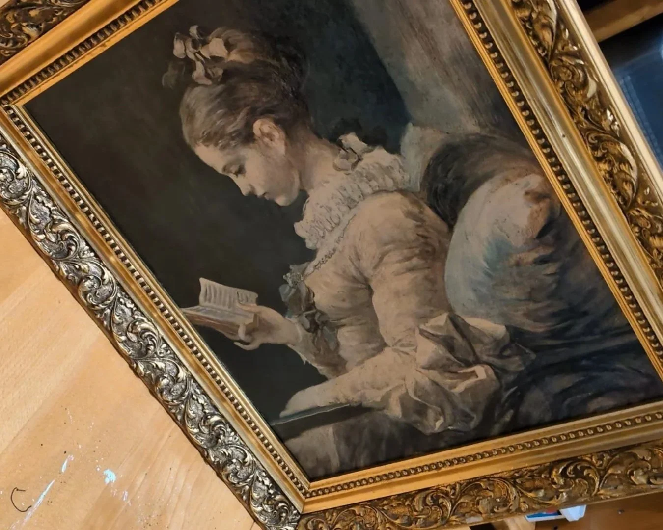Before. An After Fragonard print of a woman reading quietly by candlelight. Decorative. Passive. Contained. This is the frame that started everything.