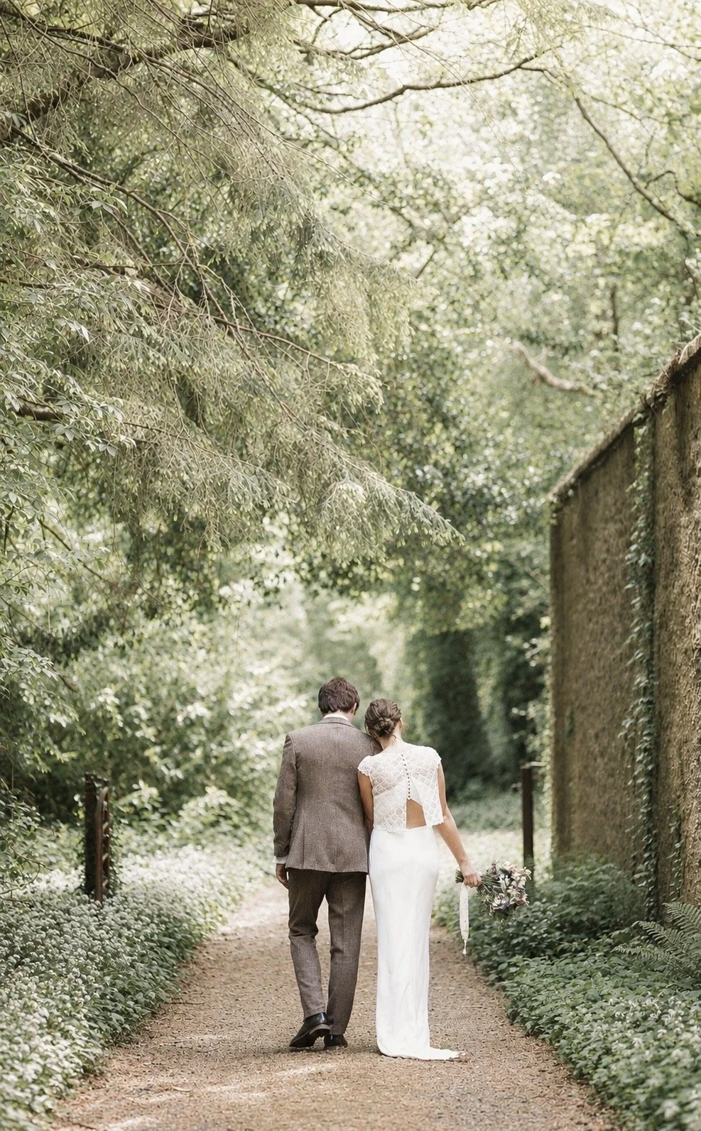 Unposed wedding photography in Ireland – couple walking together at Rathsallagh House