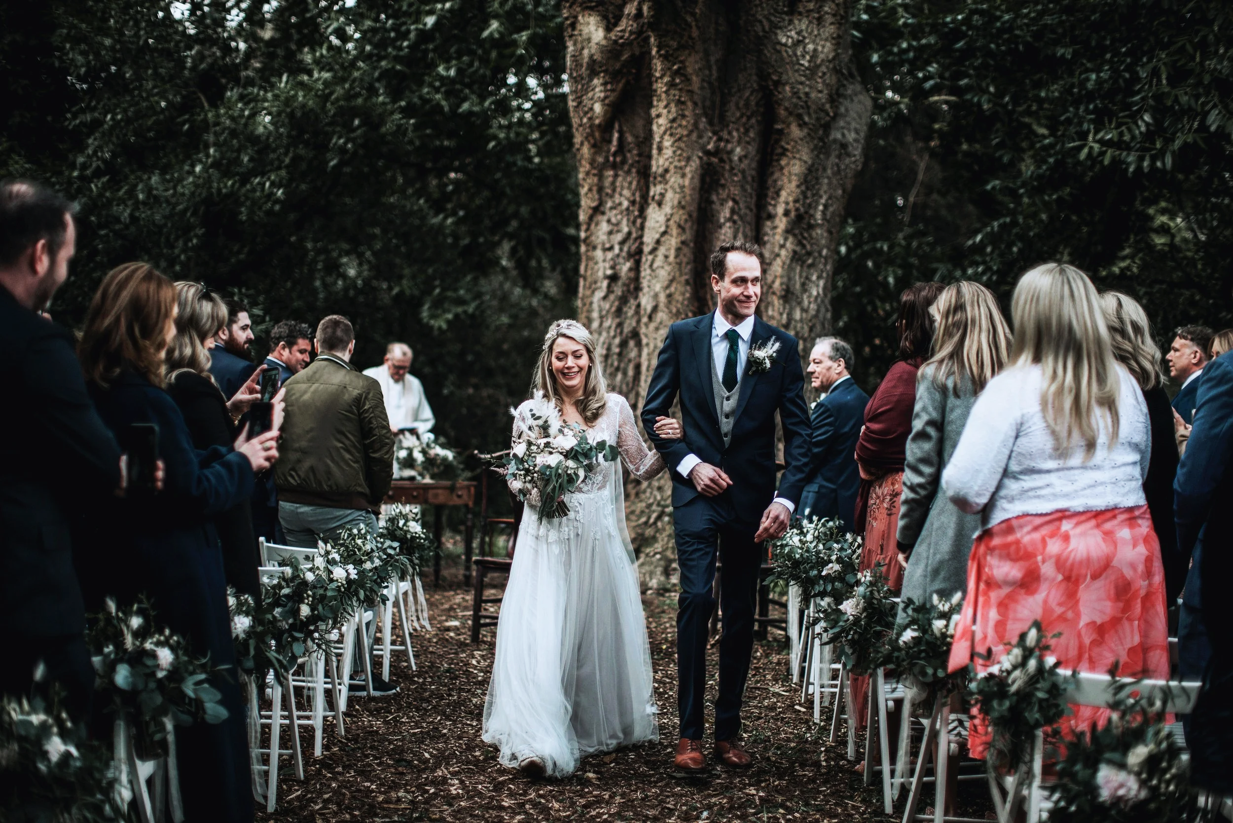 Unposed wedding photography in Ireland – couple walking together after their ceremony at Trudder Lodge Co Wicklow