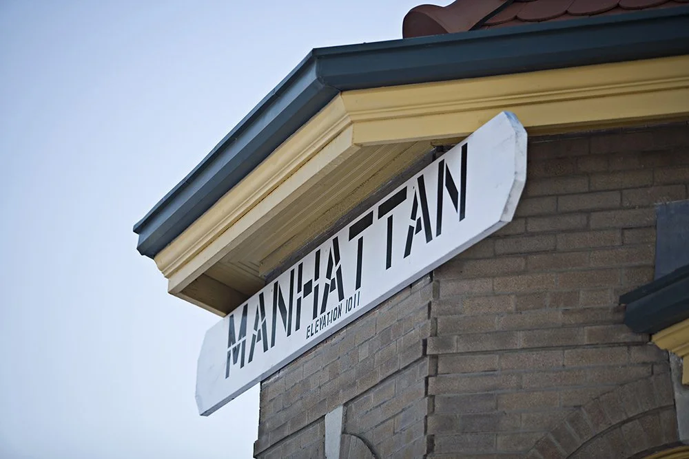 Manhattan sign on the historical train depot located in Manhattan Kansas.