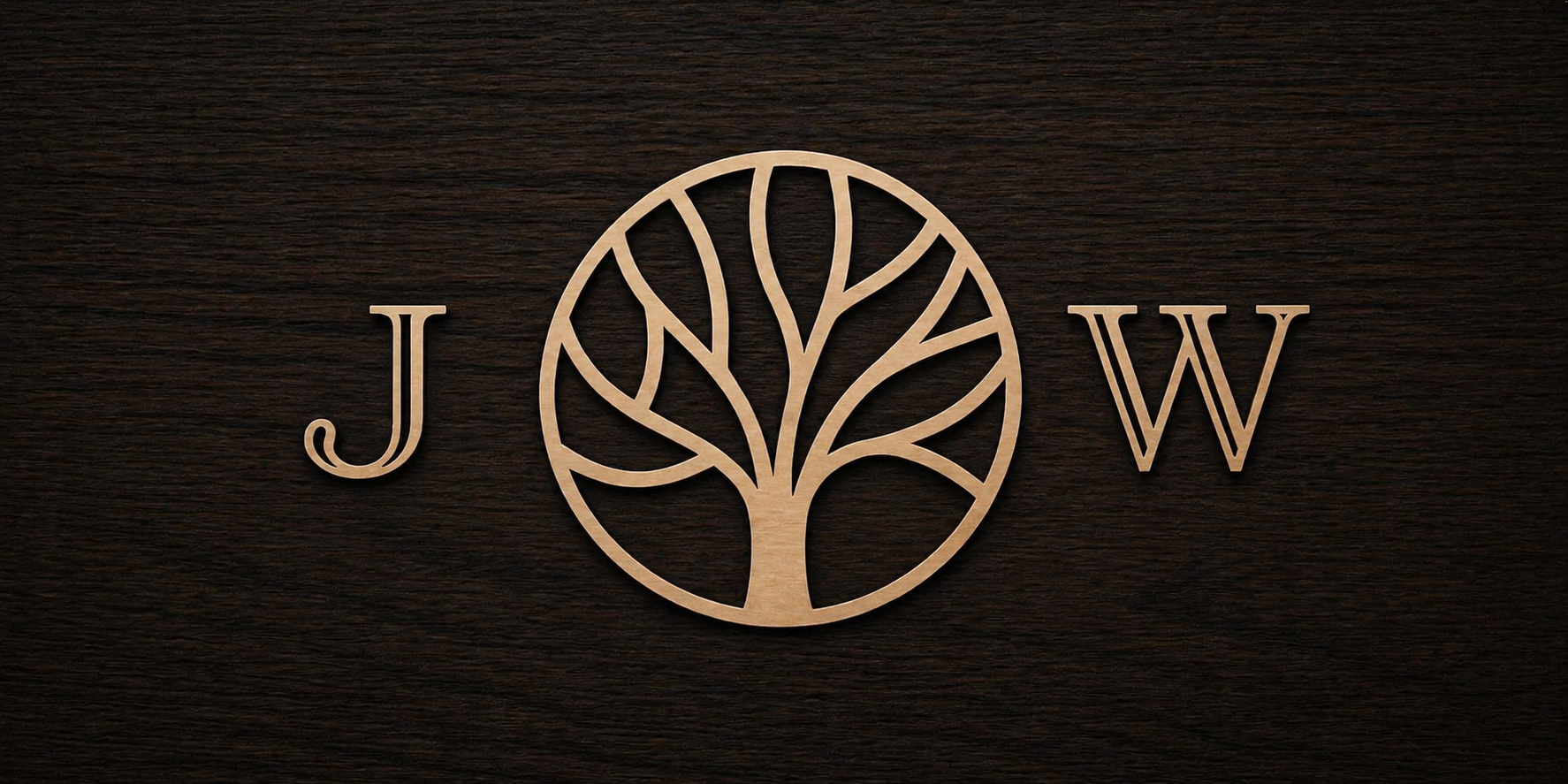 Wooden logo with the letters J and W separated by a stylized tree inside a circle, on a dark wood background.