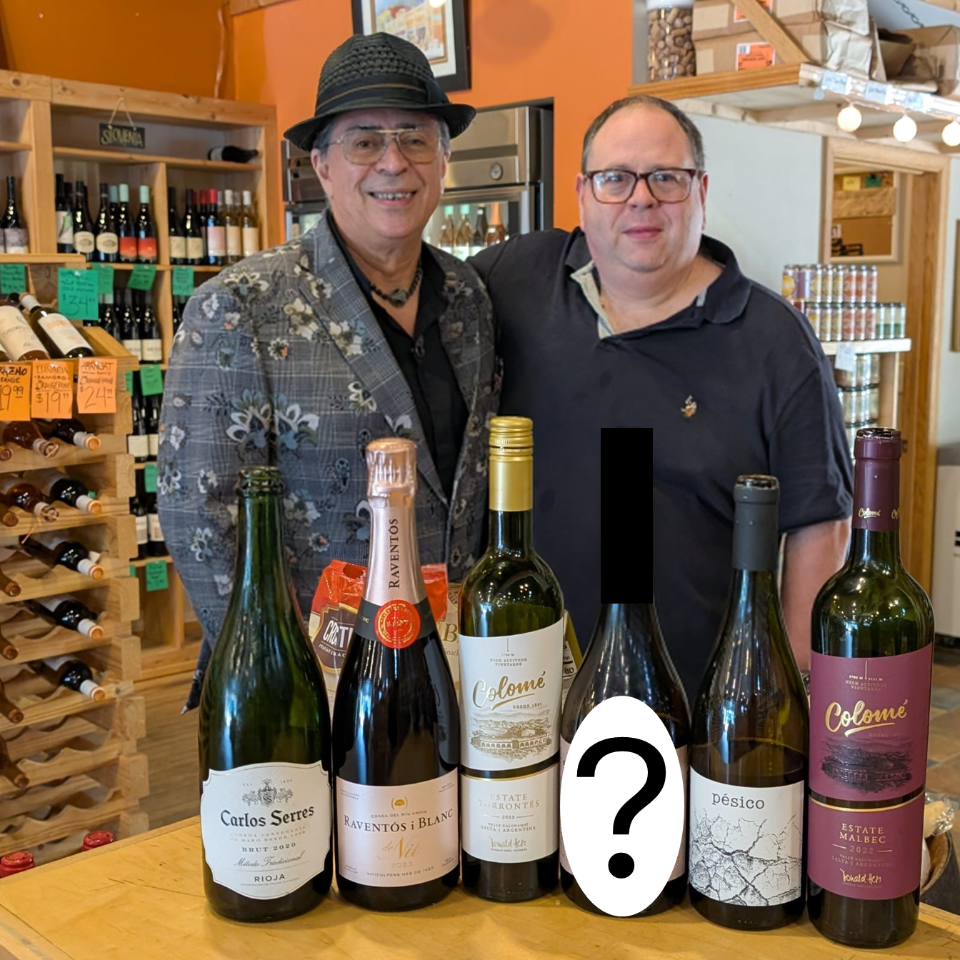 Rico and the wine donor at Solo Vino in Saint Paul with the selected wines for the tasting.
