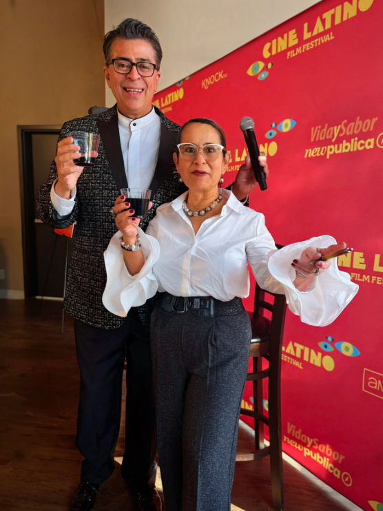 Rico with Cacao Itaca chocolate expert toasting during the wine and chocolate pairing event at Cine Latino 2025