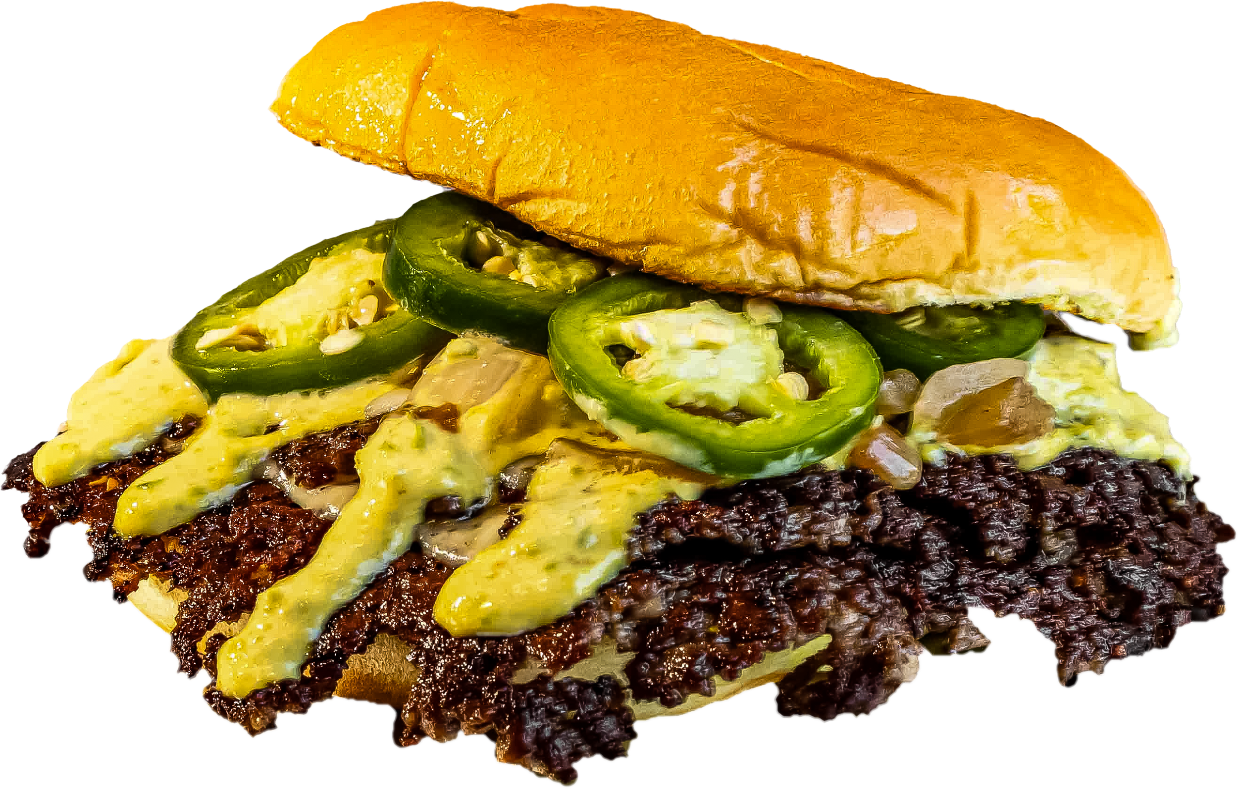 Close-up of a burger with jalapeño peppers, melted cheese, and a toasted bun. The burger patty is topped with melted cheese, jalapeños, and additional toppings inside a soft bun.