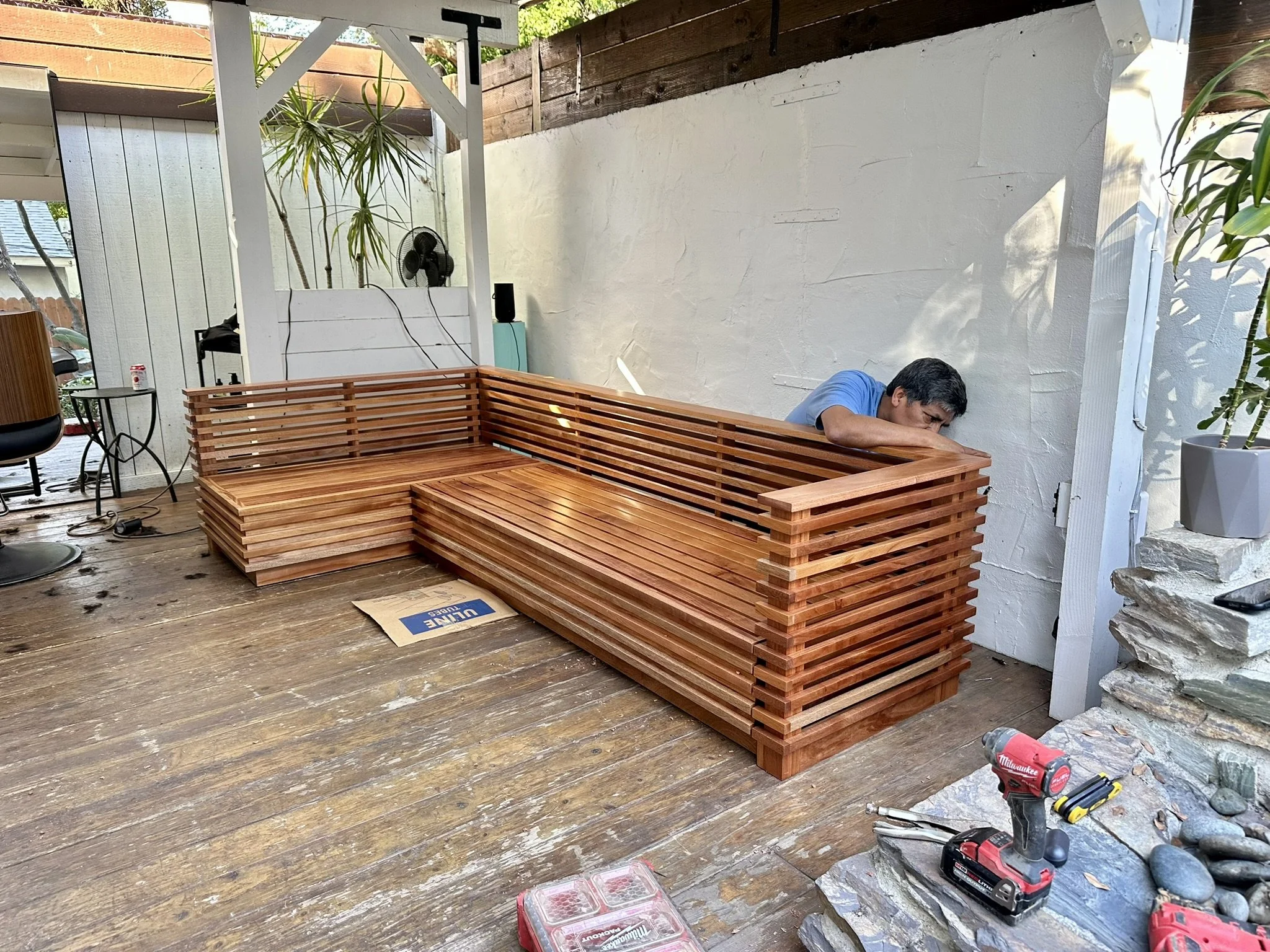 Bespoke African mahogany outdoor sectional built by Ironwood Furniture Studio, a custom furniture and woodworking studio in Los Angeles led by Emiliano Mendez.