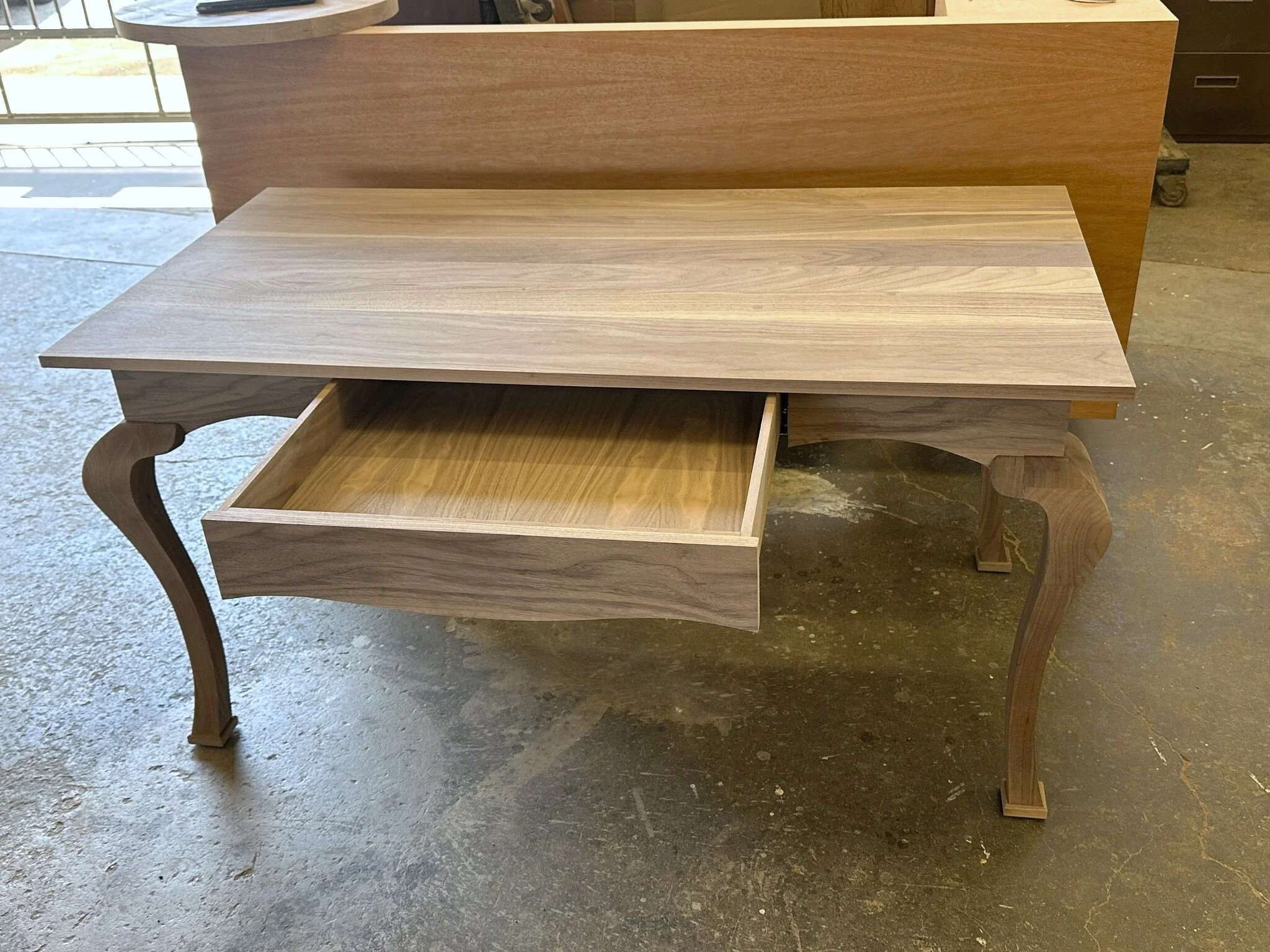 Custom sculpted walnut desk