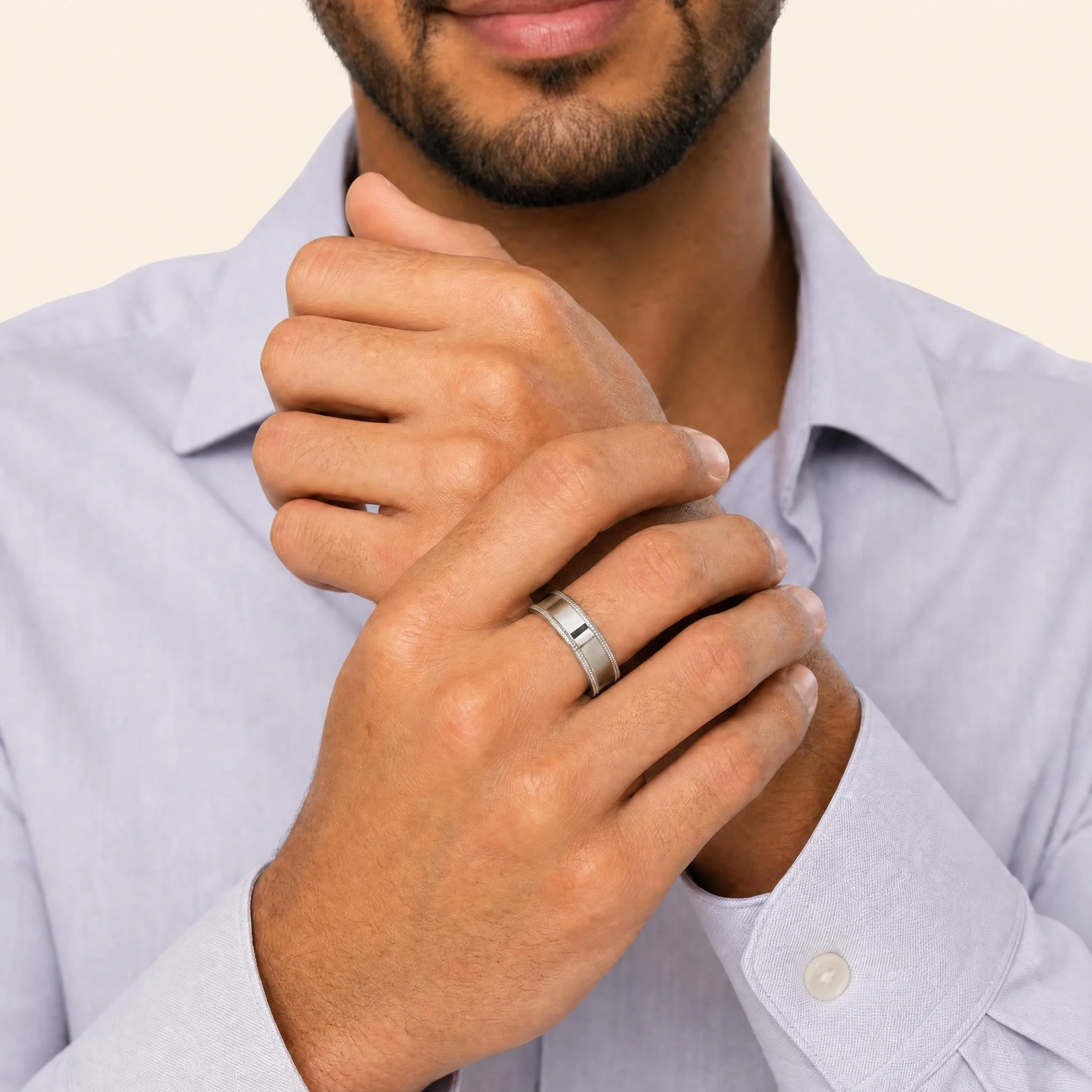 Platinum milgrain band worn on hand