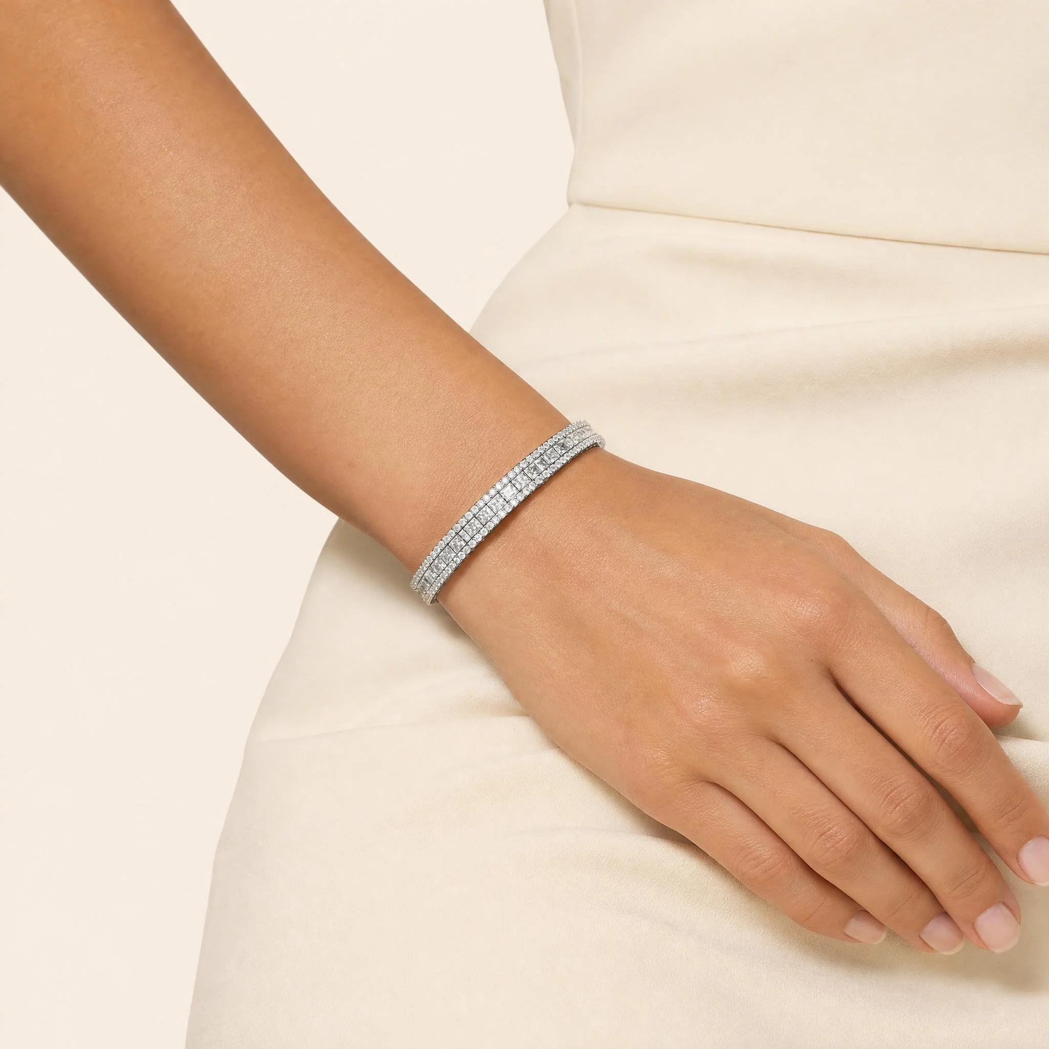 a luxury princess-cut tennis bracelet with brilliant stones, pavé detailing and an elegant openwork setting. A timeless fine-jewelry essential.jpeg