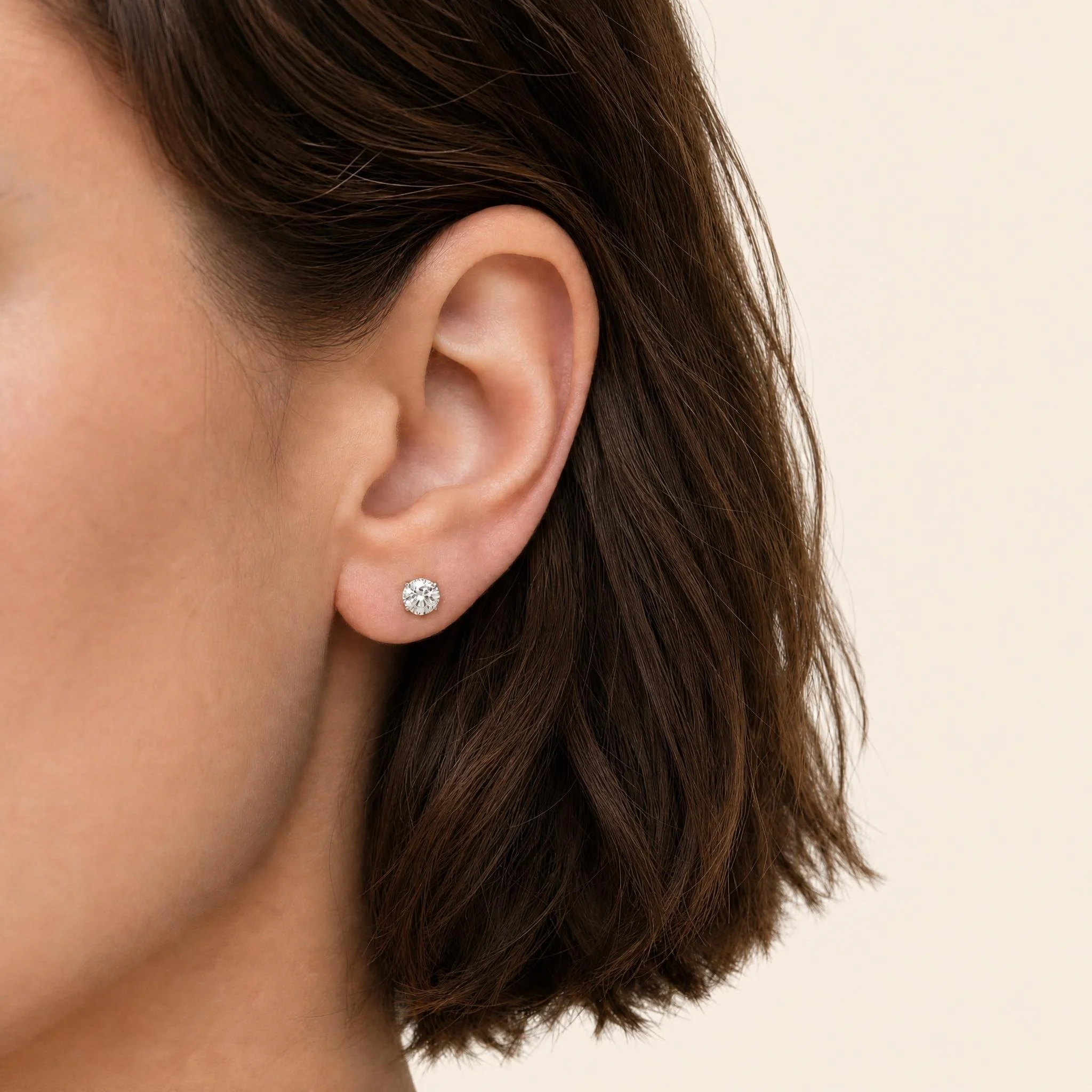 Classic Round Solitaire Stud Earrings on model.jpeg