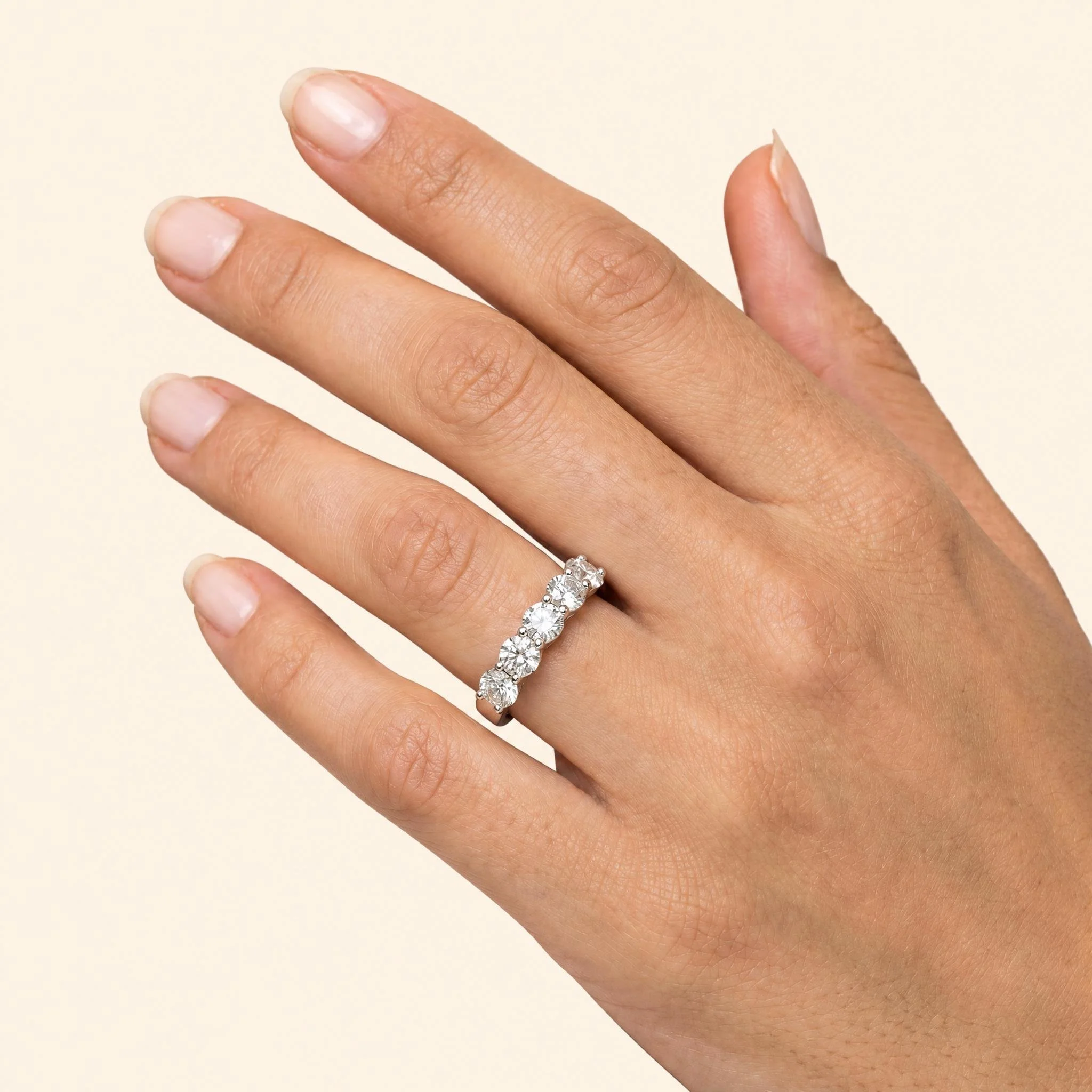 Five stone diamond band worn on hand.jpeg