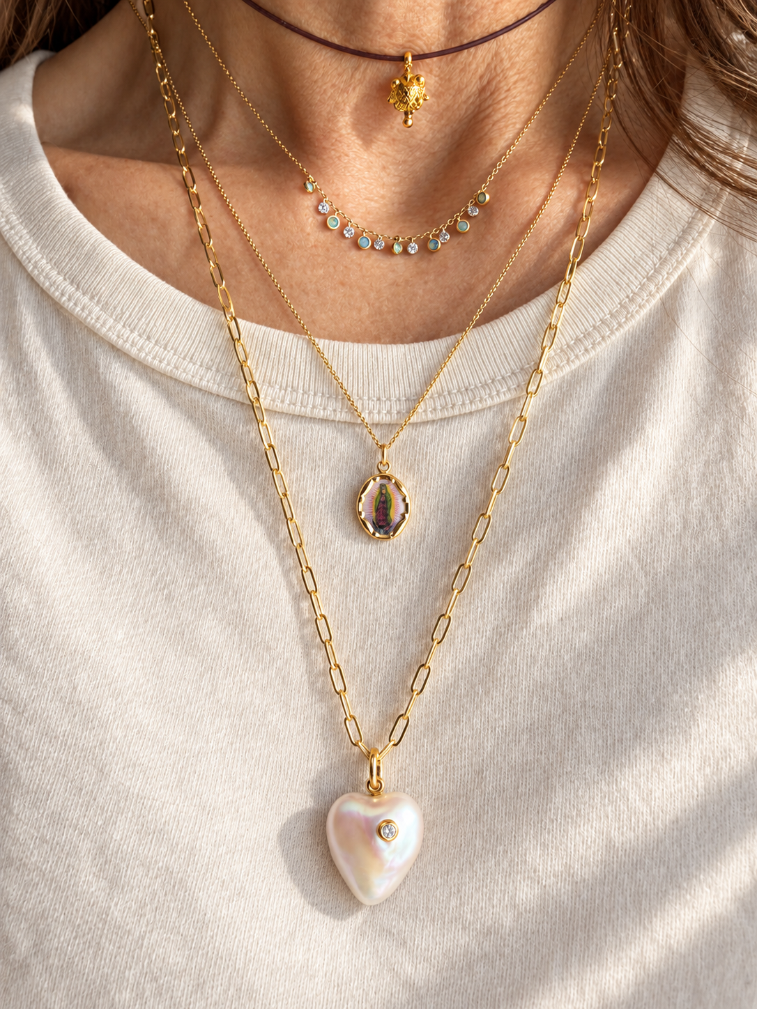 Layered Gold Necklaces with Pearl Heart Pendant.png