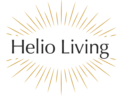 Logo of Helio Living with black background and gold rays emanating from the center.