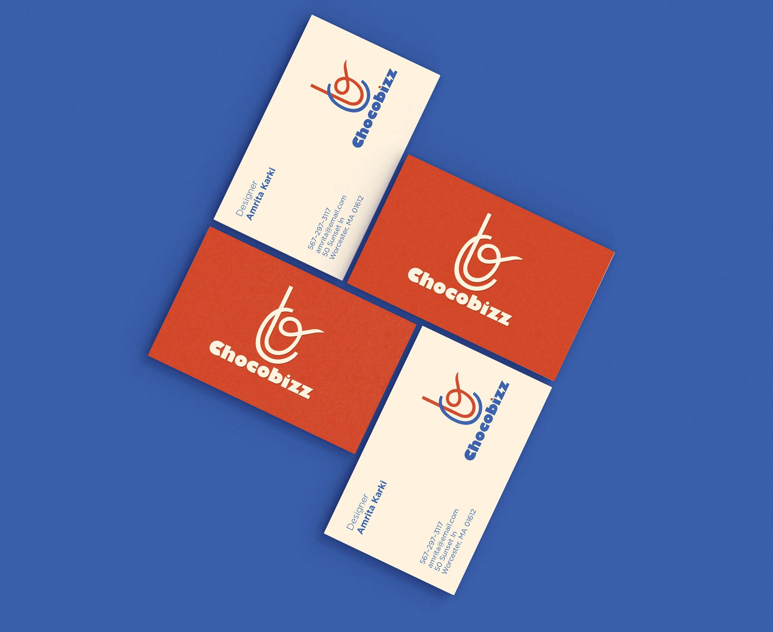 Business cards with the logo and name 'Chocoblizz', one set featuring a white background and blue text, and the other set with an orange background and white logo, all displayed on a blue surface.
