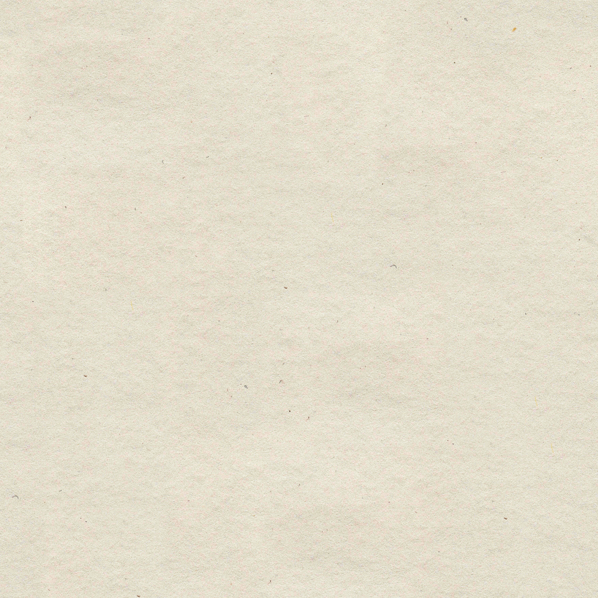 Blank, textured beige background with subtle grain and small specks.