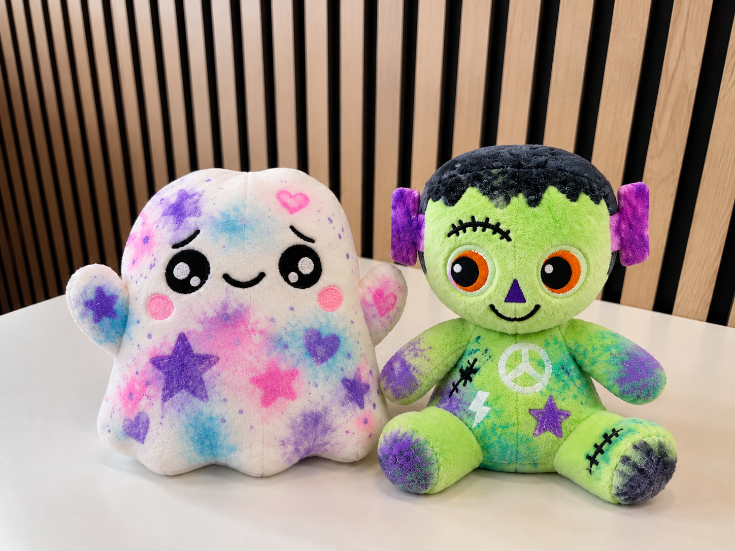 Halloween Plush Duo on Wood-Slat Backdrop.png