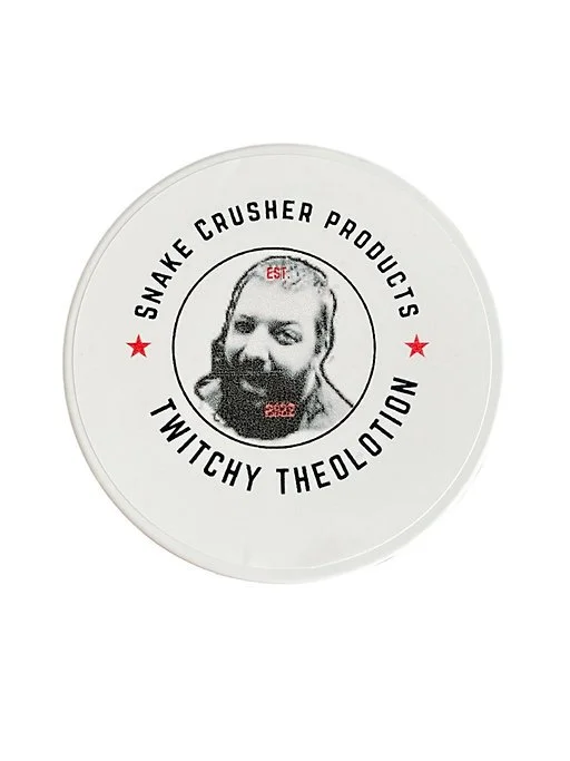 White circular sticker with a black and white photo of a person's face, surrounded by text that reads "Snake Crusher Products" and "Twitchy Theolotion" with two red stars and small red text that says "EST" and