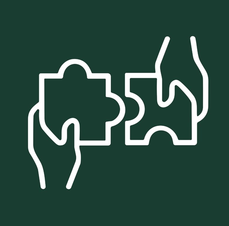 Two hands holding puzzle pieces about to connect.