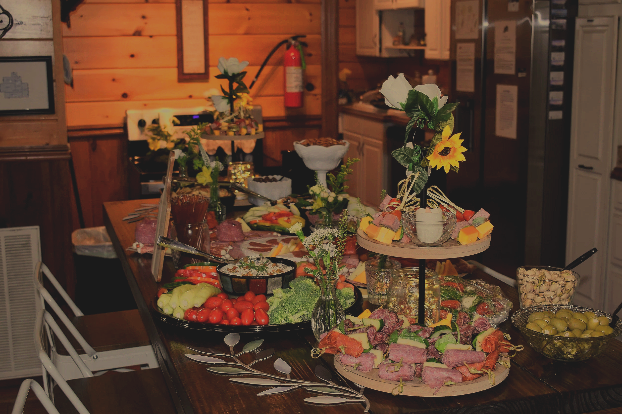 Food display on center table at wedding event to accentuate citrus summer theme and vibrant colors