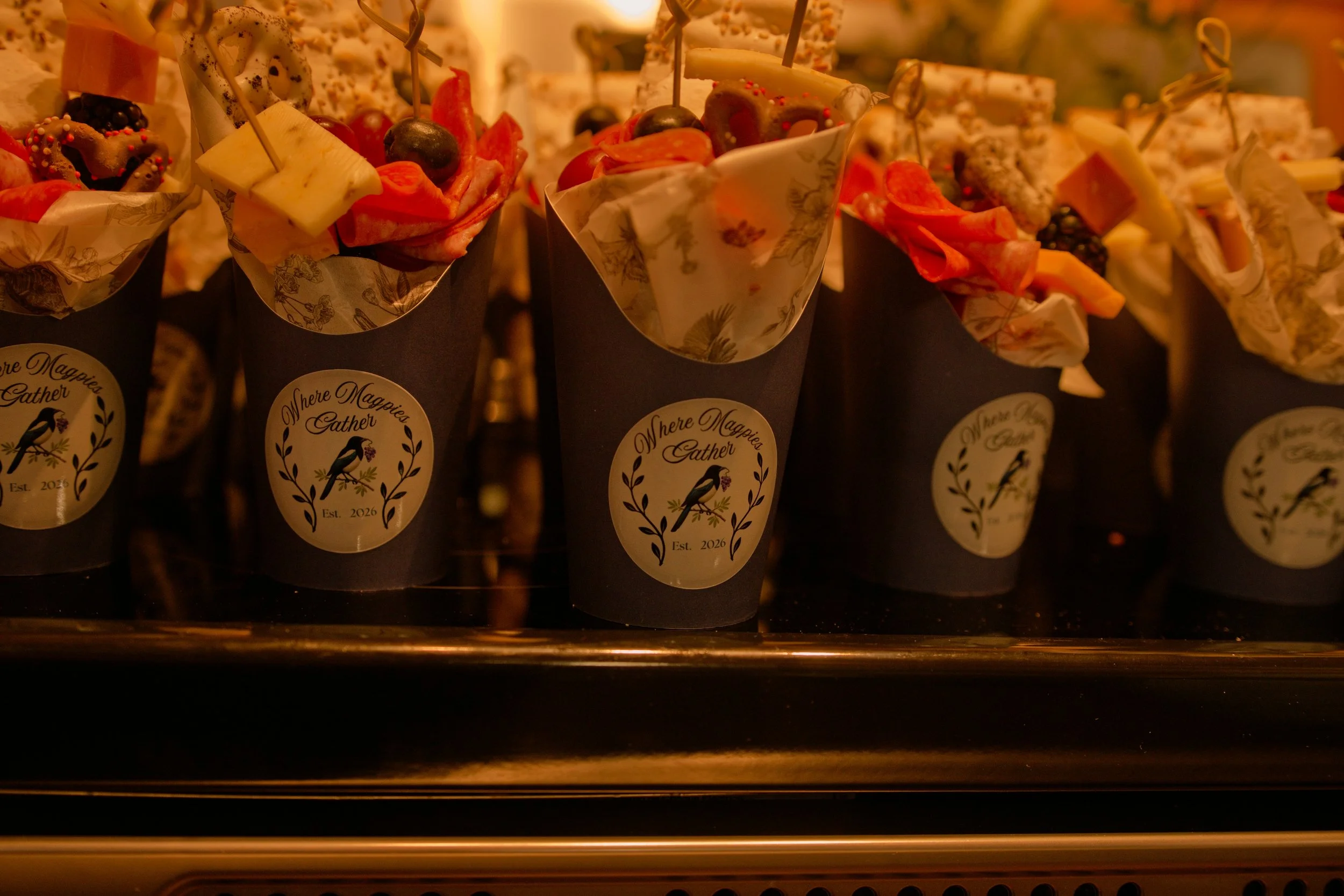 Where Magpies Gather branded 12 oz cups at wedding event