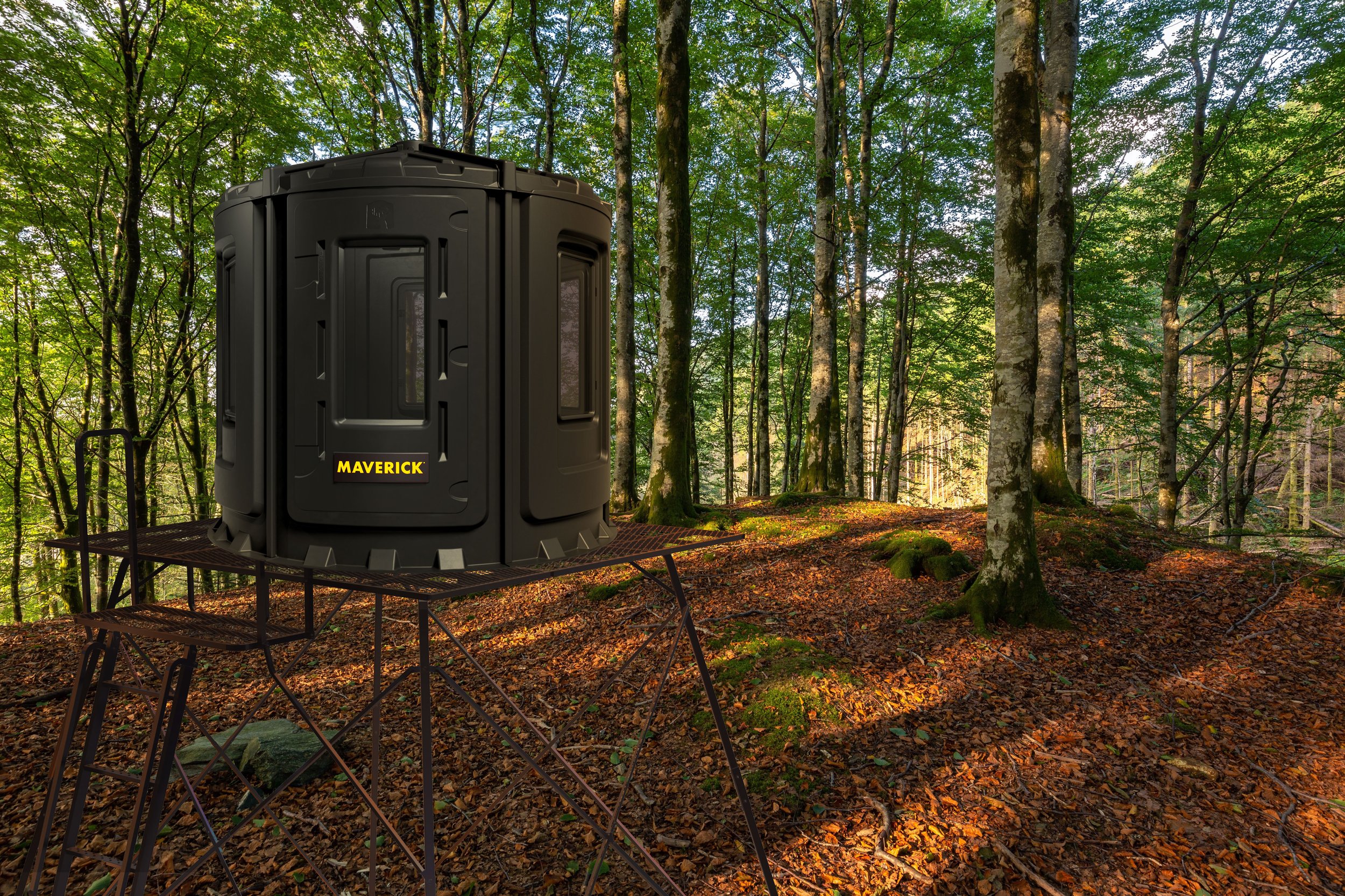 A portable toilet labeled 'MAVERICK' placed on a metal platform in a dense green forest with tall trees and fallen leaves.