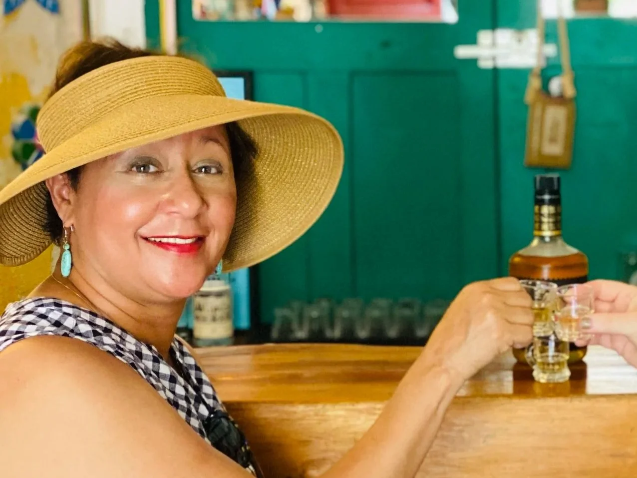 Woman having a drink at Posheria in Merica Mexico