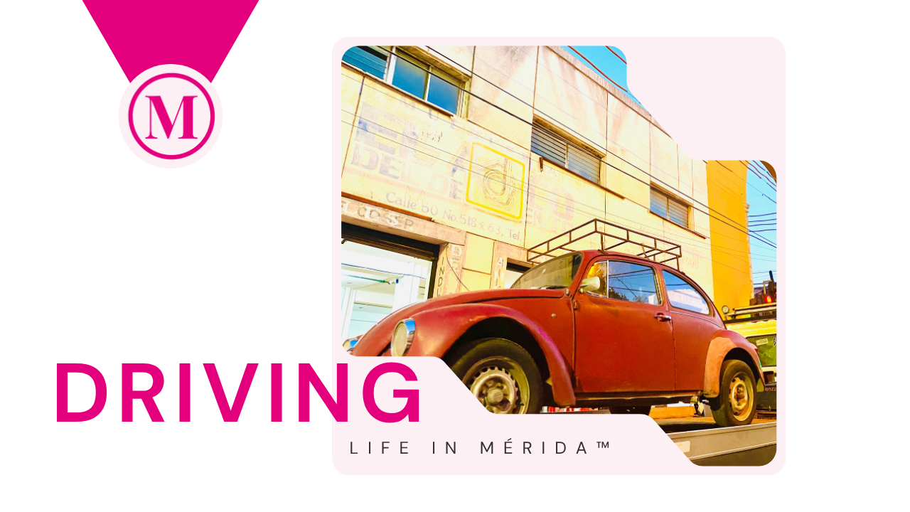 A vintage red Volkswagen Beetle parked in an urban area with a colorful building in the background, under a clear sky.
