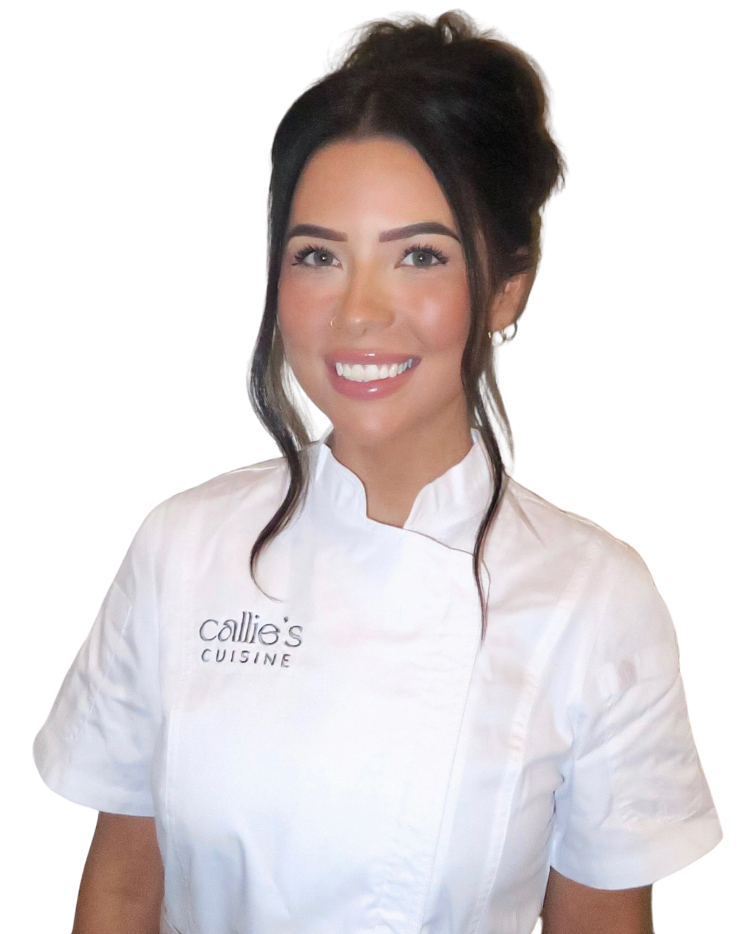 A woman in a white chef's coat with 'Callie's Cuisine' embroidered on it, smiling at the camera.