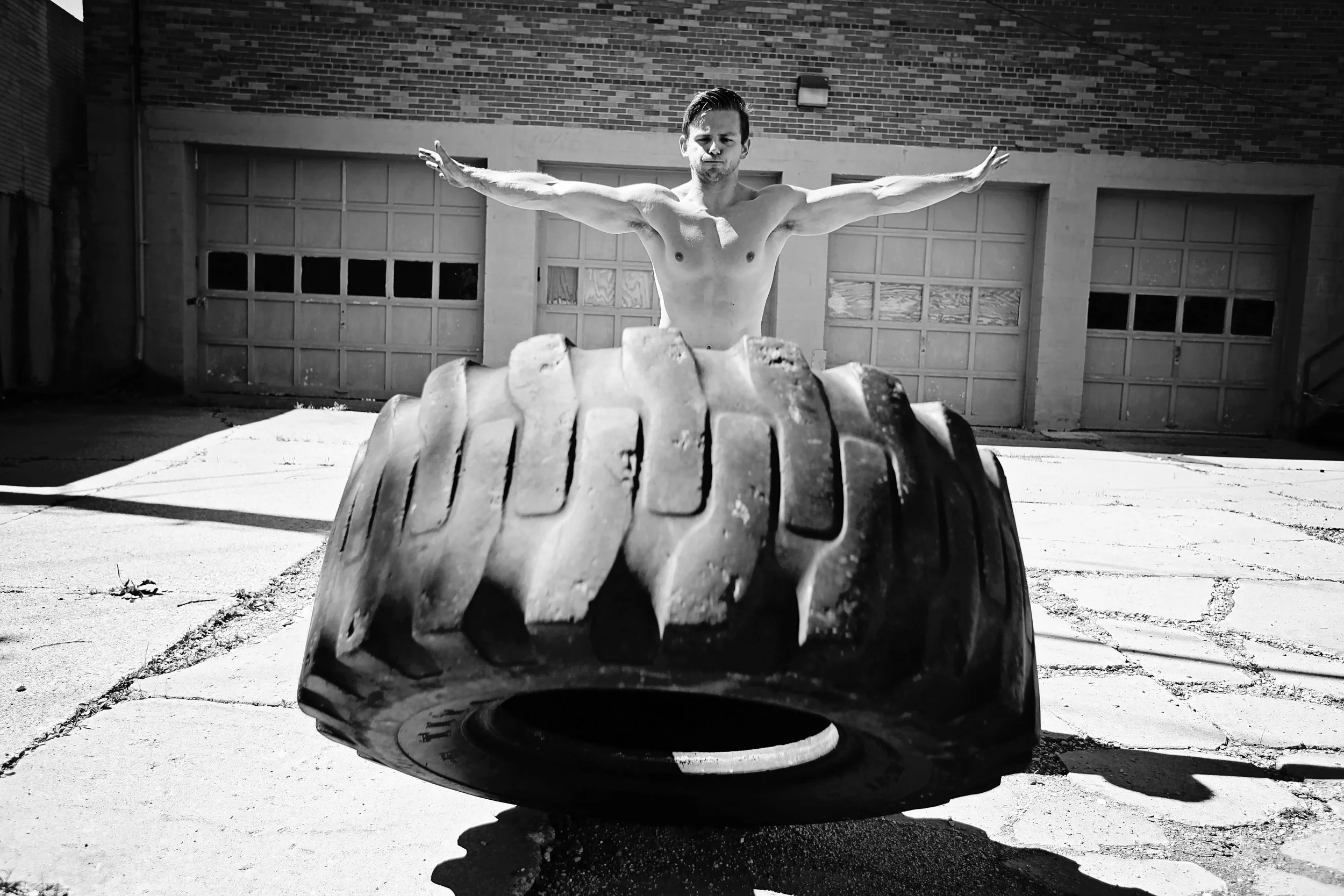 Adam looking like "Arnold" on the tire flips